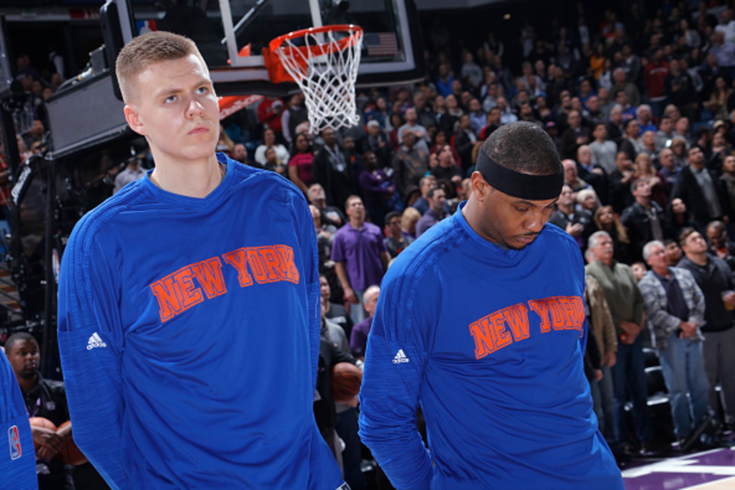 SACRAMENTO, CA - DECEMBER 10: Kristaps Porzingis #6 and Carmelo Anthony #7 of the New York Knicks look on during the national anthem of the game against the Sacramento Kings on December 10, 2015 at Sleep Train Arena in Sacramento, California. NOTE TO USER