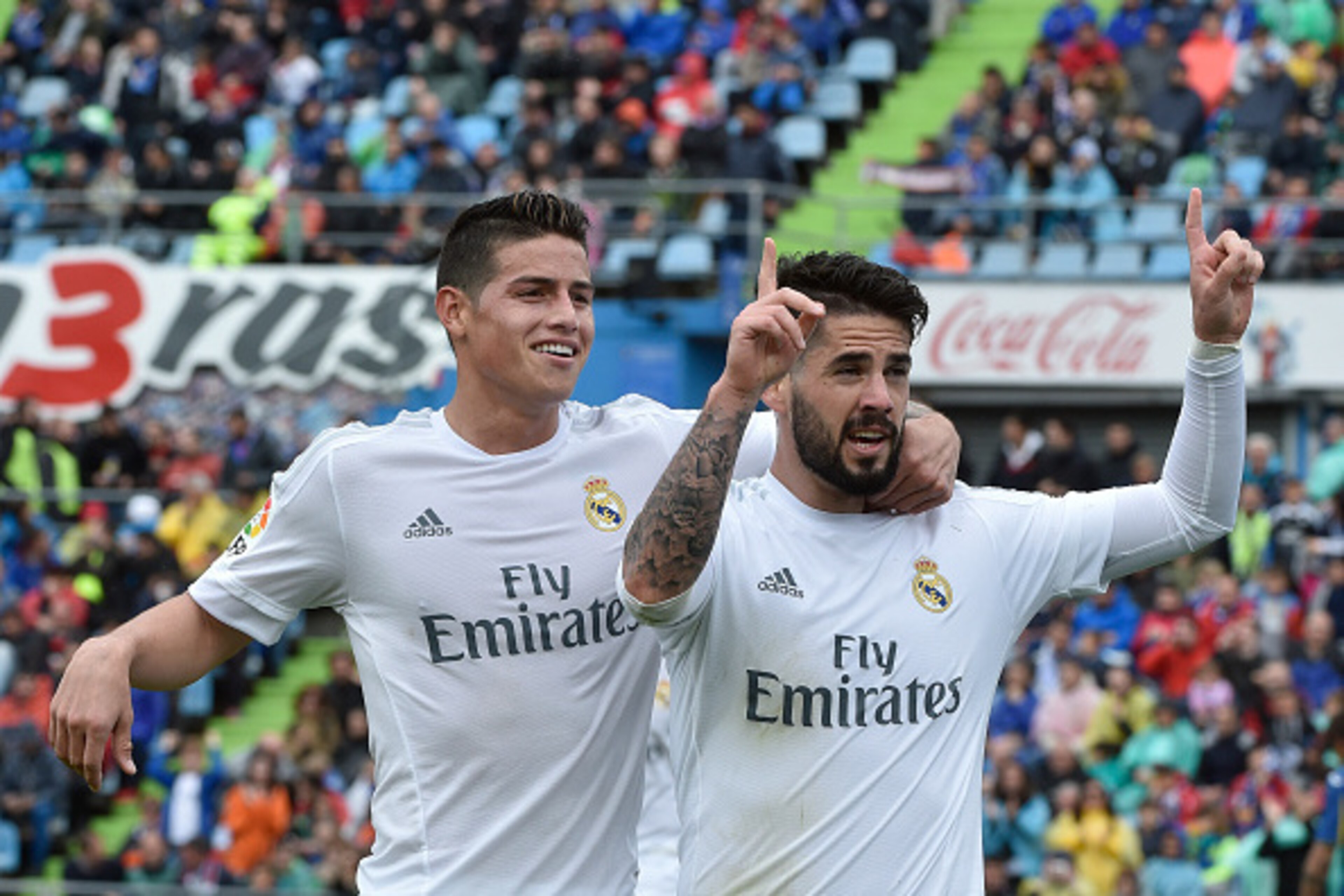 Real Madrid's midfielder Isco (R) celebrates a goal with Real Madrid's Colombian midfielder James Rodriguez during the Spanish league football match Getafe CF vs Real Madrid CF at the Coliseum Alfonso Perez stadium in Getafe on April 16, 2016. / AFP / GER Real Madrid's midfielder Isco (R) celebrates a goal with Real Madrid's Colombian midfielder James Rodriguez during the Spanish league football match Getafe CF vs Real Madrid CF at the Coliseum Alfonso Perez stadium in Getafe on April 16, 2016. / AFP / GER