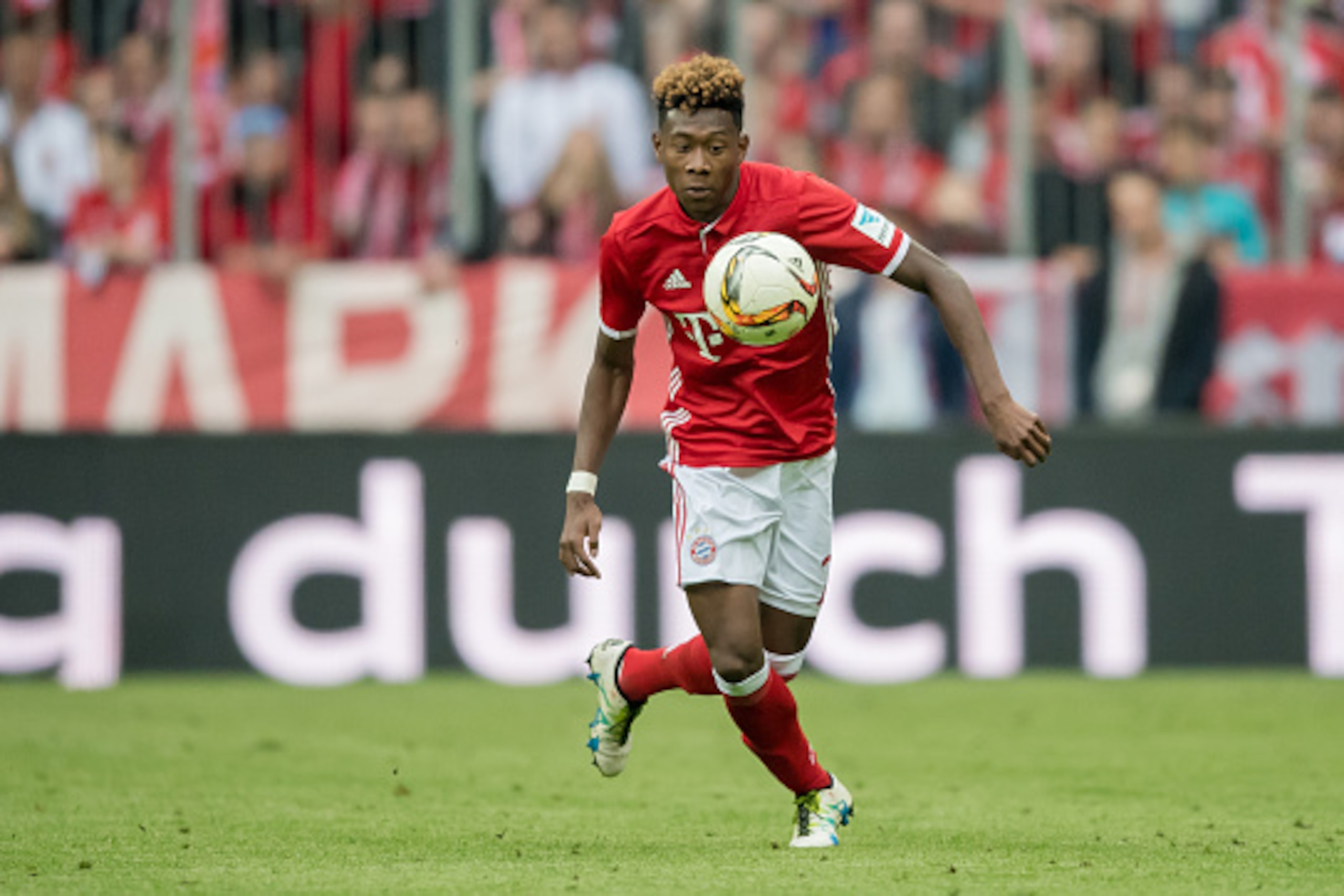MUNICH, GERMANY - MAY 14:  David Alaba of Muenchen runs with the ball during the Bundesliga match between FC Bayern Muenchen and Hannover 96 at Allianz Arena on May 14, 2016 in Munich, Germany.  (Photo by Boris Streubel/Getty Images)