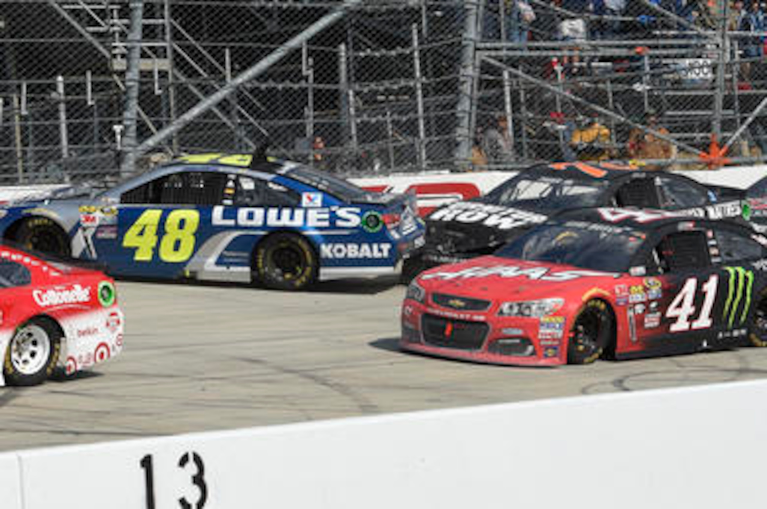 A crash took Jimmie Johnson (48) out of Busch's (41) way.
