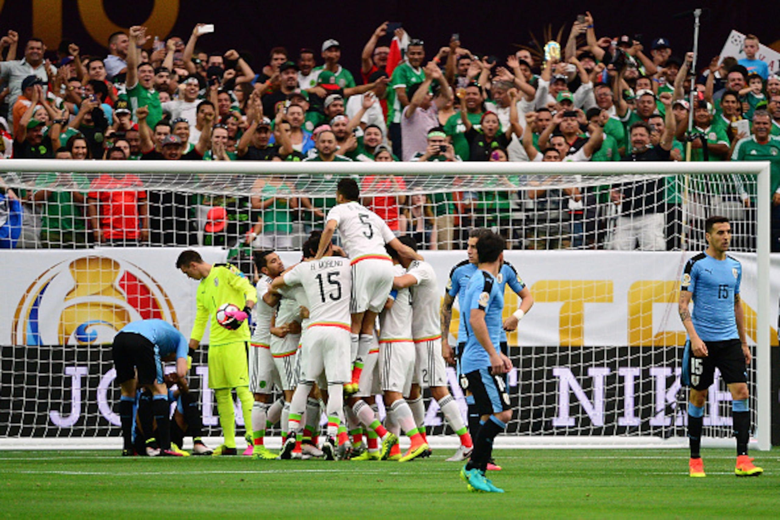 GLENDALE, AZ - JUNE 05:  Hector Herrera #16 of Mexico celebrates with teammates after a first period goal during the 2016 Copa America Centenario Group C match against Uruguay at University of Phoenix Stadium on June 5, 2016 in Glendale, Arizona.  (Photo 
