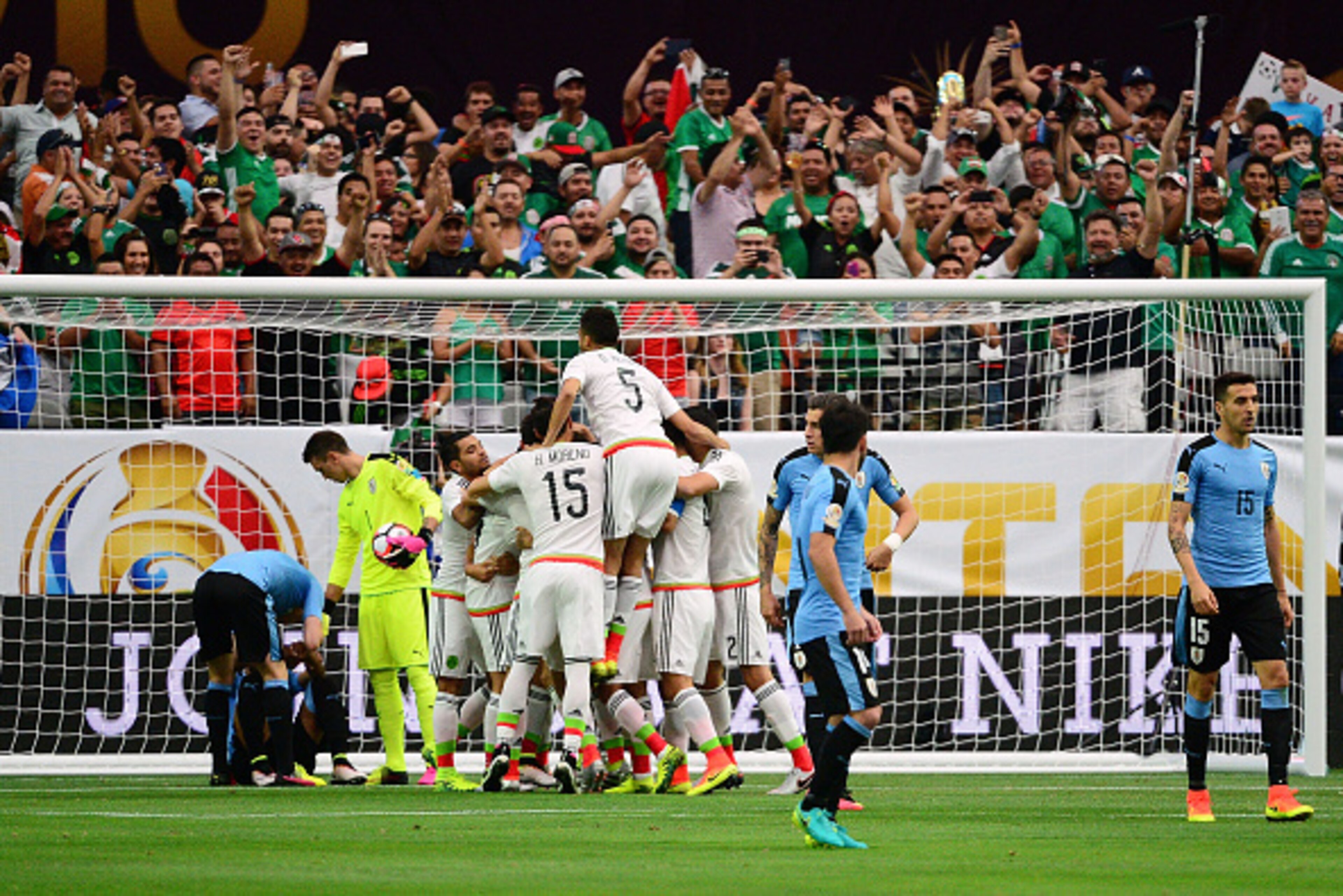 GLENDALE, AZ - JUNE 05:  Hector Herrera #16 of Mexico celebrates with teammates after a first period goal during the 2016 Copa America Centenario Group C match against Uruguay at University of Phoenix Stadium on June 5, 2016 in Glendale, Arizona.  (Photo 