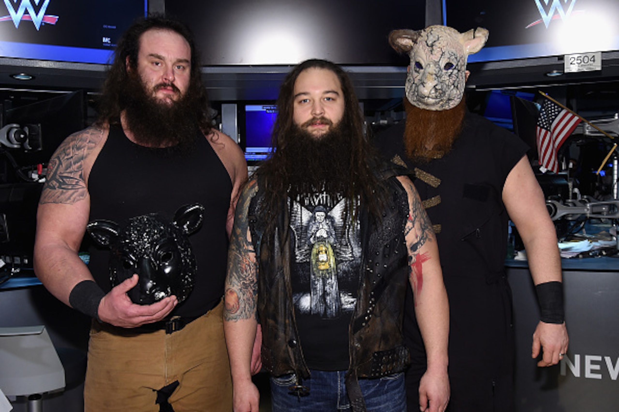 NEW YORK, NY - MARCH 29:  WWE Superstars Braun Strowman, Bray Wyatt and Erick Rowan ring The New York Stock Exchange Opening Bell in honor of WrestleMania 32  at New York Stock Exchange on March 29, 2016 in New York City.  (Photo by Jamie McCarthy/Getty I