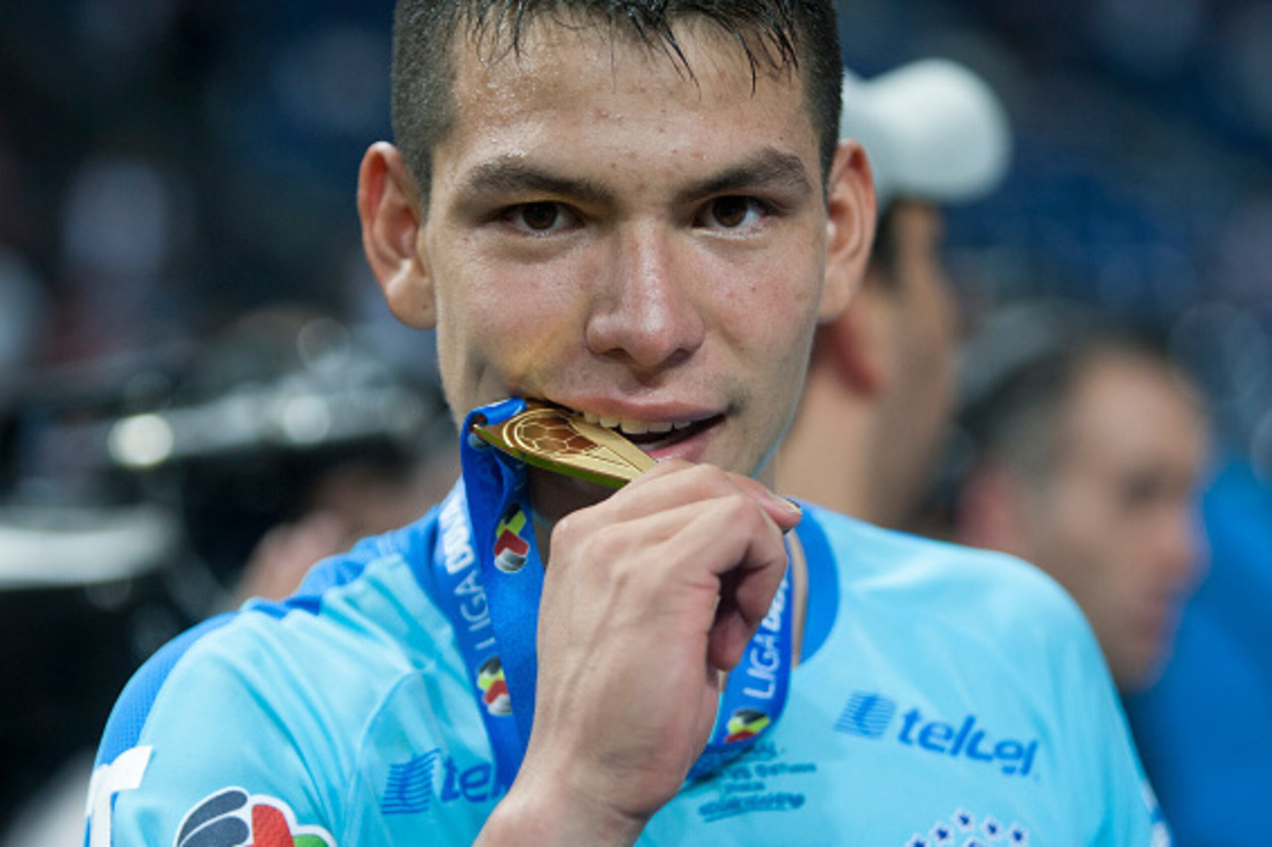 Pachuca's footballer Hirving Lozano celebrates with his medal after winning the trophy following their win against Monterrey during their Mexican Clausura 2016 tournament football final match at the BBVA Bancomer stadium in Monterrey, Mexico on May, 29, 2