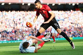 MANCHESTER, ENGLAND - MAY 22:  Jamie Vardy of England goes down in the box under a challenge from Mehmet Topal of Turkey during the International Friendly match between England and Turkey at Etihad Stadium on May 22, 2016 in Manchester, England.  (Photo b