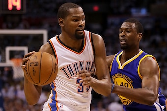 OKLAHOMA CITY, OK - MAY 24:  Kevin Durant #35 of the Oklahoma City Thunder drives against Harrison Barnes #40 of the Golden State Warriors in the third quarter in game four of the Western Conference Finals during the 2016 NBA Playoffs at Chesapeake Energy