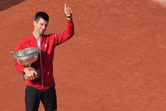 PARIS, FRANCE - JUNE 05:  Novak Djokovic of Serbia poses with the trophy after winning his men's singles final match against Andy Murray of Great Britain on day fifteen of the 2016 French Open at Roland Garros on June 5, 2016 in Paris, France.  (Photo by 