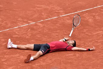 PARIS, FRANCE - JUNE 05:  Novak Djokovic of Serbia reacts after winning his men's singles final match against Andy Murray of Great Britain on day fifteen of the 2016 French Open at Roland Garros on June 5, 2016 in Paris, France.  (Photo by Aurelien Meunie