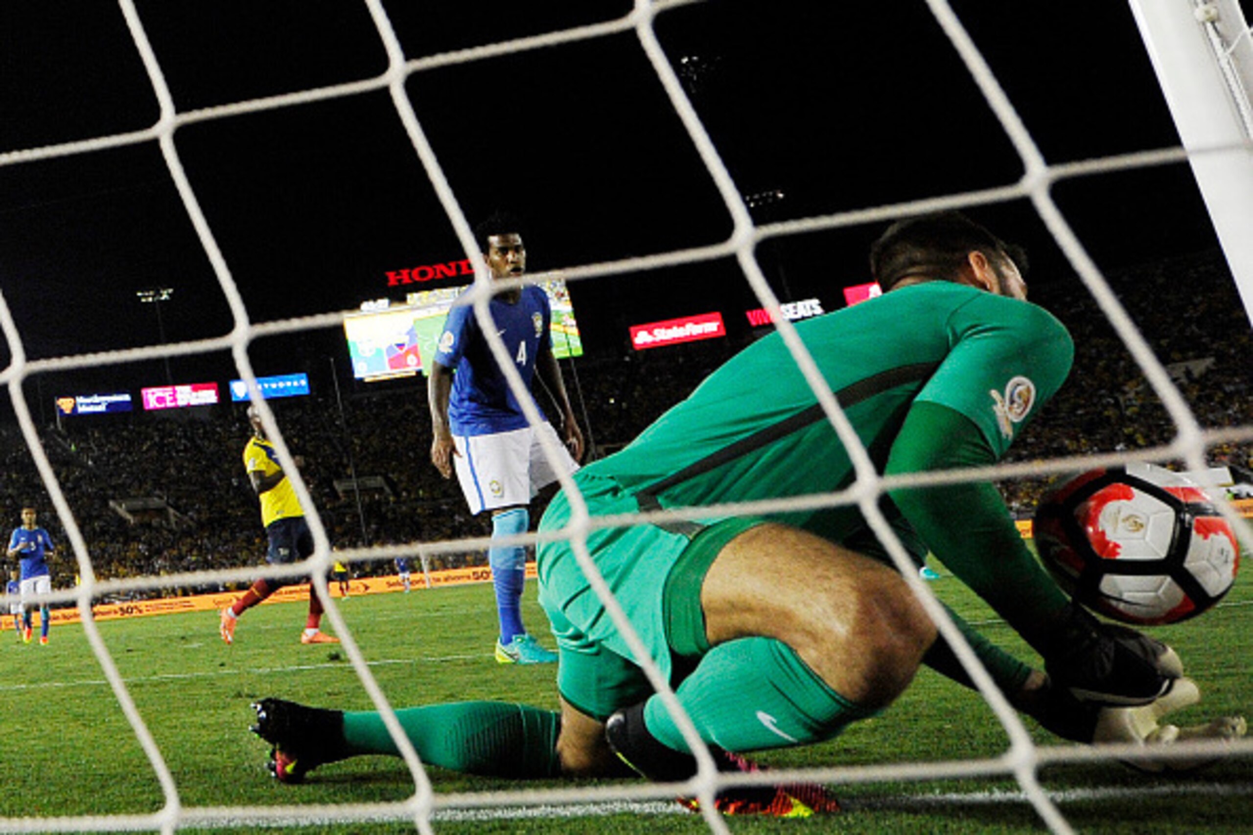 PASADENA, CA - JUNE 4: The soccer ball bounces off the shoulder of goalkeeper Alisson Becker #1 of Brazil and bounces into the goal during the second half against Ecuador but the goal was not allowed during 2016 Copa America Centenario Group B match betwe PASADENA, CA - JUNE 4: The soccer ball bounces off the shoulder of goalkeeper Alisson Becker #1 of Brazil and bounces into the goal during the second half against Ecuador but the goal was not allowed during 2016 Copa America Centenario Group B match betwe