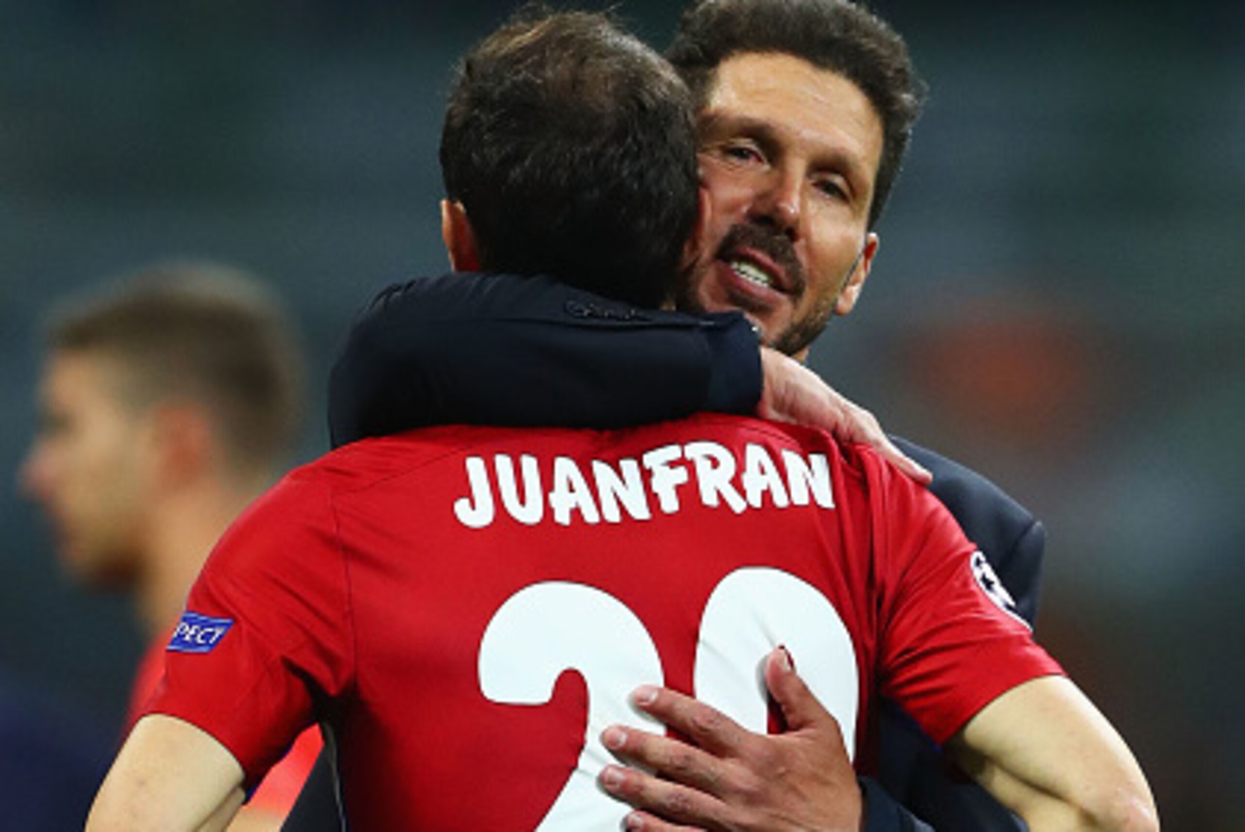 MILAN, ITALY - MAY 28:  Club Atletico de Madrid head coach Diego Simeone hugs a desperate Juanfran after the UEFA Champions League Final match between Real Madrid and Club Atletico de Madrid at Stadio Giuseppe Meazza on May 28, 2016 in Milan, Italy.  (Pho