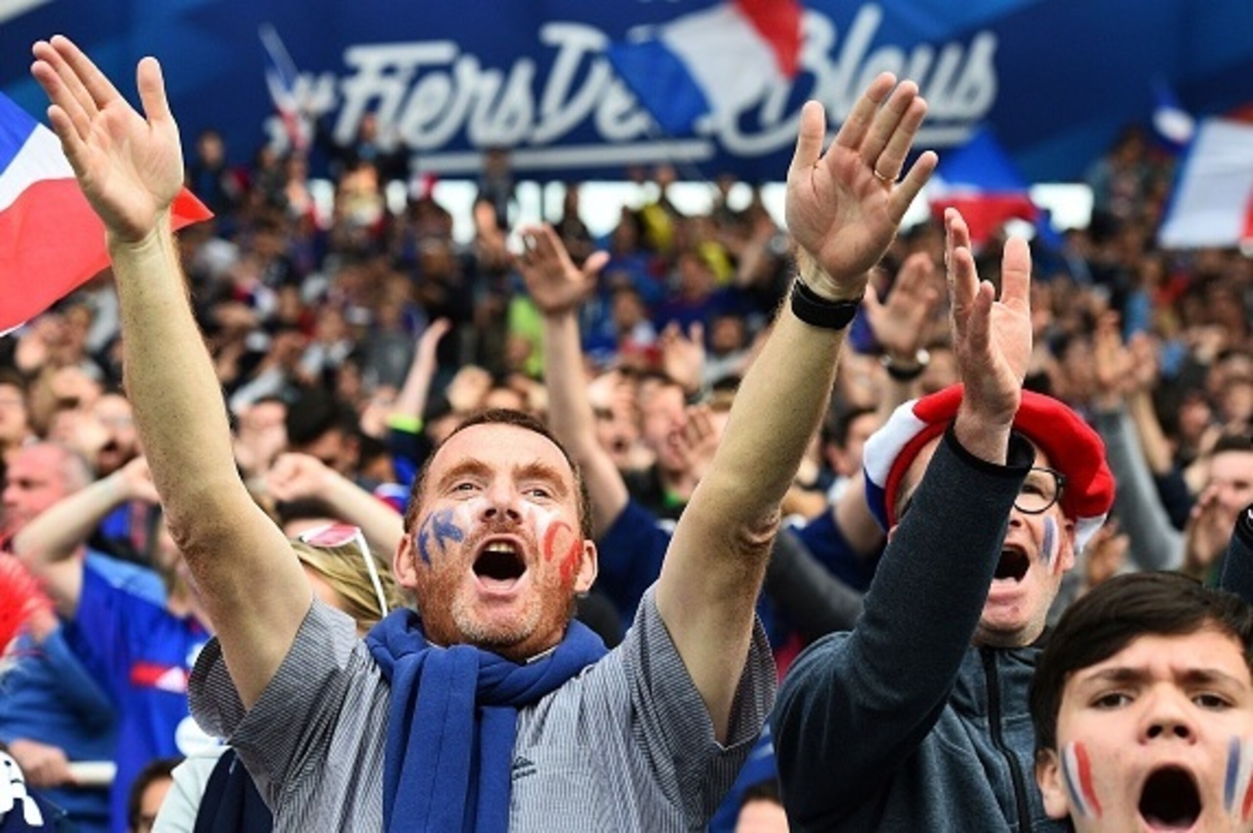 France's supporters cheer during the friendly football match between France and Cameroon, at the Beaujoire Stadium in Nantes, western France, on May 30, 2016. 
France won 3-2.   / AFP / FRANCK FIFE        (Photo credit should read FRANCK FIFE/AFP/Getty Im