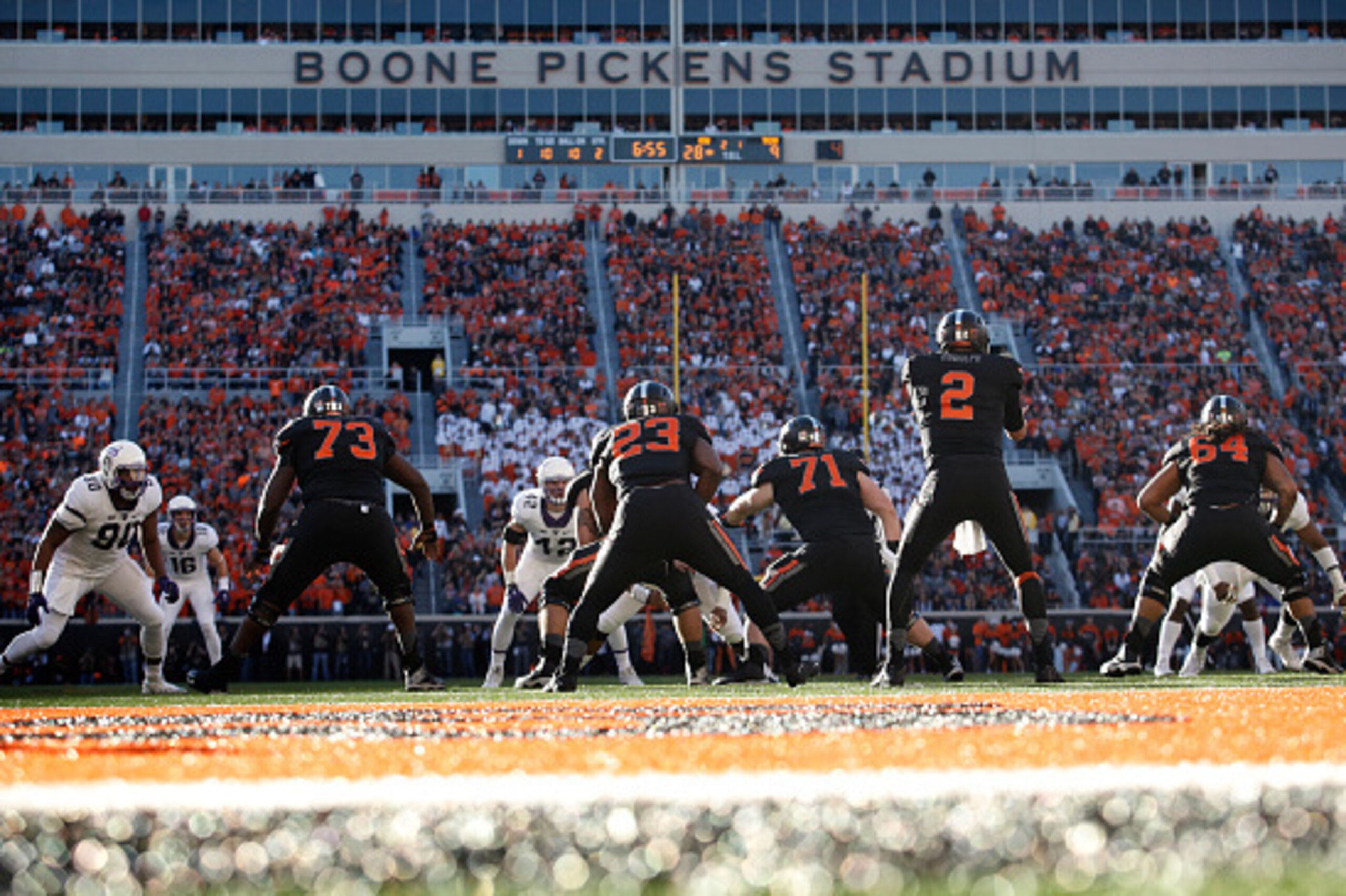 STILLWATER, OK - NOVEMBER 7 : Quarterback Mason Rudolph #2 of the Oklahoma State Cowboys takes a snap against the TCU Horned Frogs November 7, 2015 at Boone Pickens Stadium in Stillwater, Oklahoma. The Cowboys defeated the Horned Frogs 49-29. (Photo by Br
