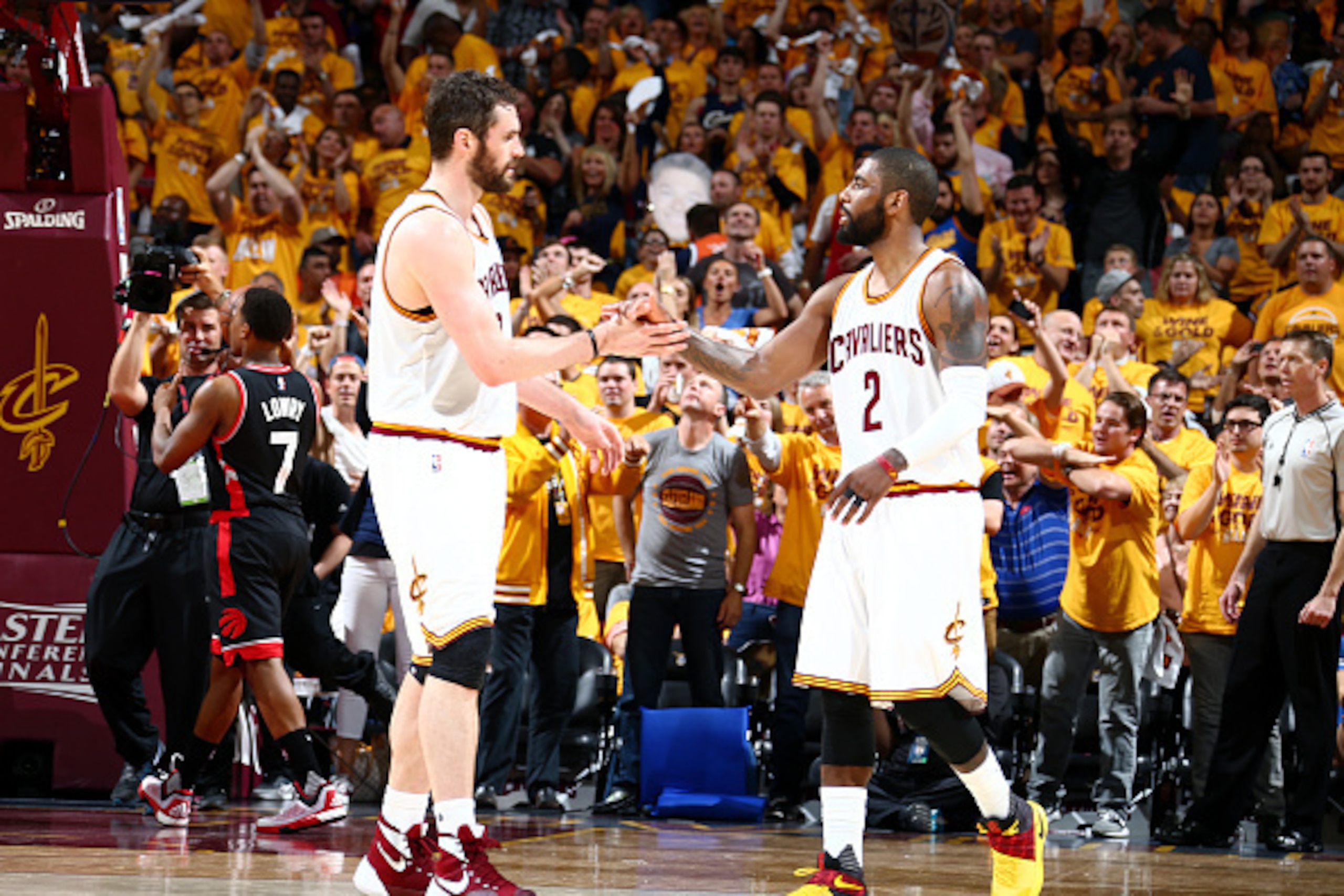 CLEVELAND, OH - MAY 25:  Kevin Love #0 of the Cleveland Cavaliers shakes hands with Kyrie Irving #2 of the Cleveland Cavaliers during the game against the Toronto Raptors in Game Five of the Eastern Conference Finals during the 2016 NBA Playoffs on May 25