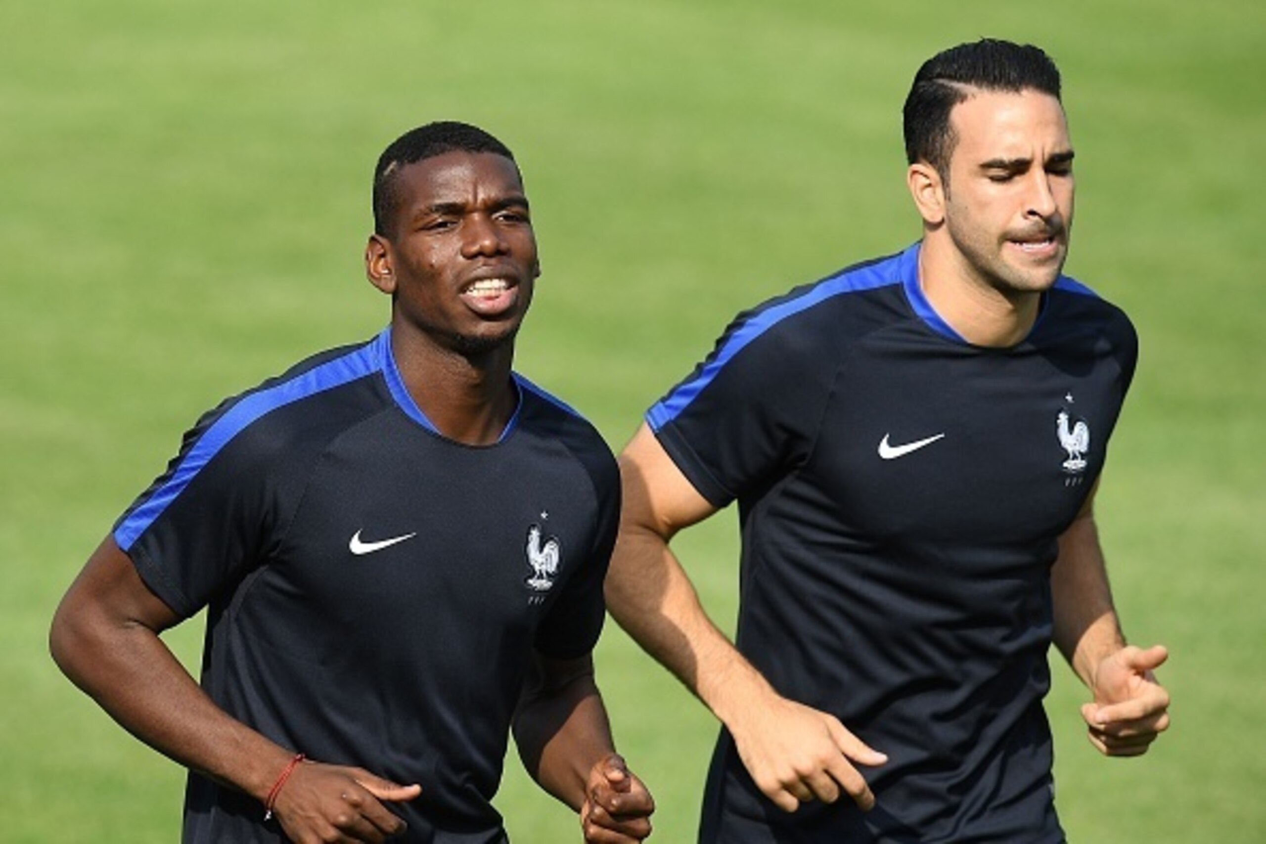 France's midfielder Paul Pogba (L) and France's defender Adil Rami run at their training ground in Clairefontaine-en-Yvelines, southwest of Paris, on June 6, 2016, ahead of the beginning of the Euro 2016 football tournament. / AFP / FRANCK FIFE (Ph France's midfielder Paul Pogba (L) and France's defender Adil Rami run at their training ground in Clairefontaine-en-Yvelines, southwest of Paris, on June 6, 2016, ahead of the beginning of the Euro 2016 football tournament. / AFP / FRANCK FIFE (Ph