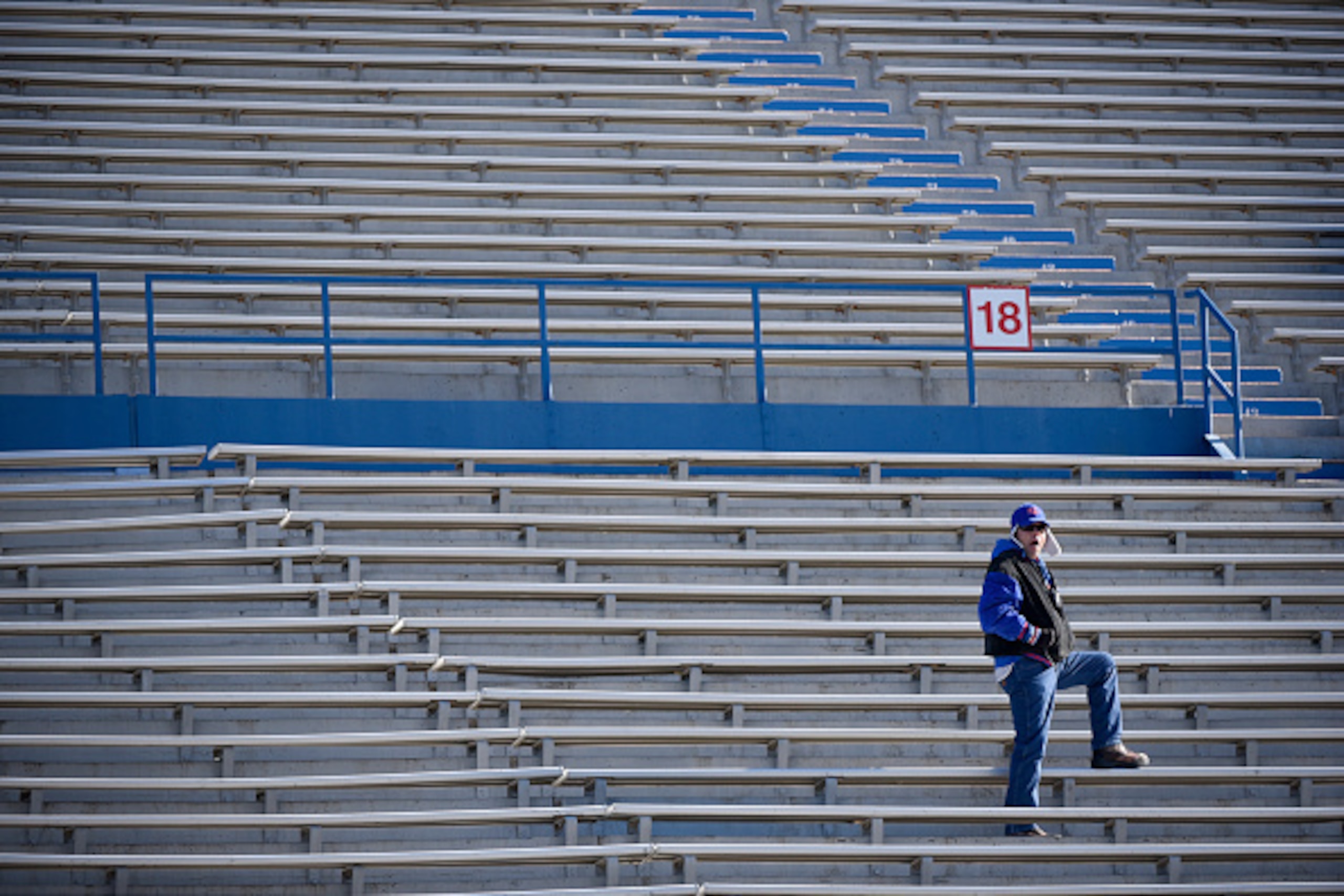LAWRENCE, KS - NOVEMBER 21:  A lone fan watches a game between the West Virginia Mountaineers and Kansas Jayhawks in the first quarter at Memorial Stadium on November 21, 2015 in Lawrence, Kansas.  (Photo by Ed Zurga/Getty Images)