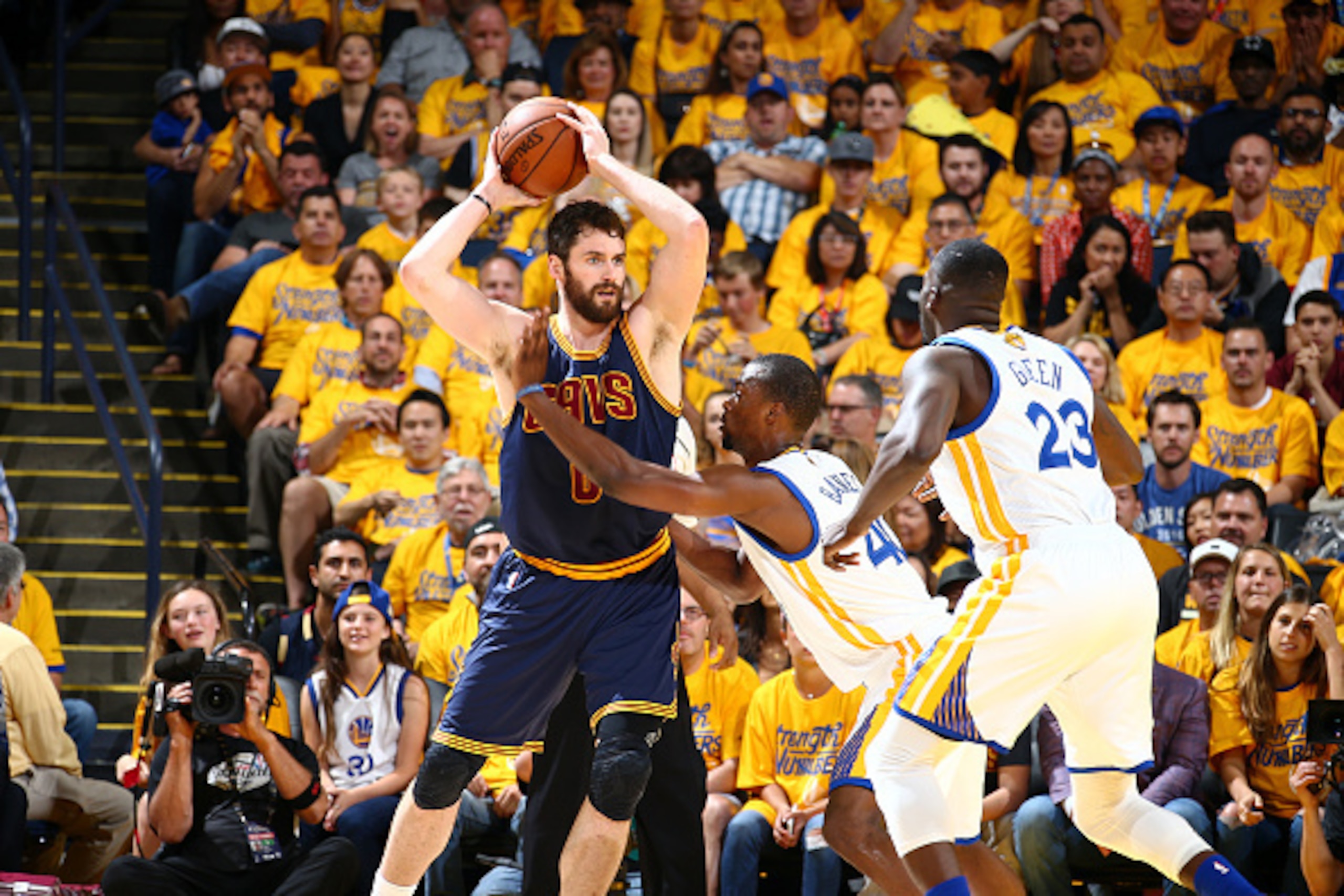 OAKLAND, CA - JUNE 5:  Kevin Love #0 of the Cleveland Cavaliers handles the ball against Harrison Barnes #40 of the Golden State Warriors in Game Two of the 2016 NBA Finals on June 5, 2016 at Oracle Arena in Oakland, California. NOTE TO USER: User express