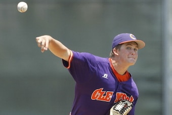 CORAL GABLES, FL - APRIL 21: Clate Schmidt #32 of the Clemson Tigers throws the ball against the Miami Hurricanes on April 21, 2013 at Alex Rodriguez Park at Mark Light Field in Coral Gables, Florida. Miami defeated Clemson 7-0. (Photo by Joel Auerbach/Ge