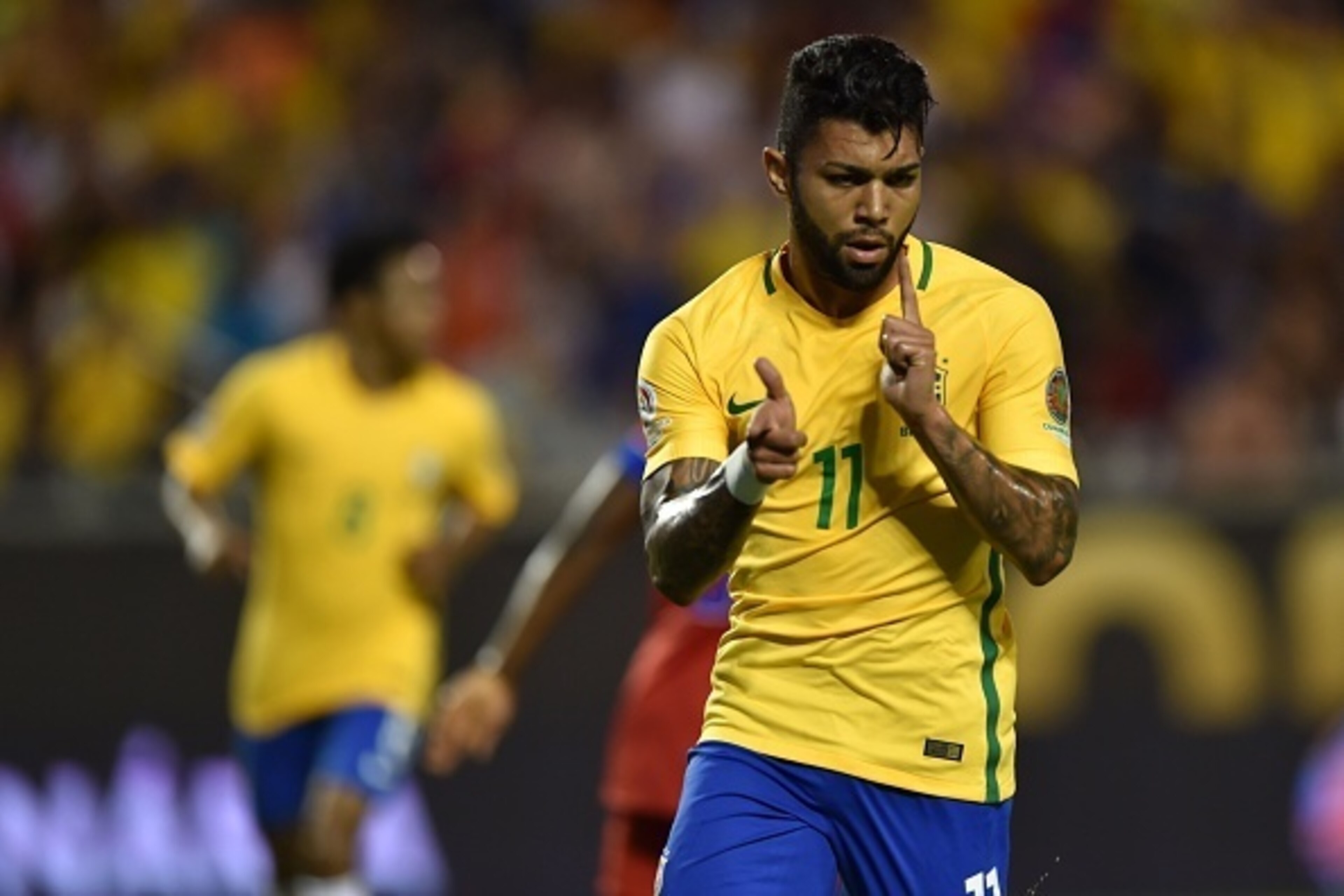 Brazil's Gabriel celebrates after scoring against Haiti during a Copa America Centenario football match in Orlando, Florida, United States, on June 8, 2016.  / AFP / Hector RETAMAL        (Photo credit should read HECTOR RETAMAL/AFP/Getty Images)
