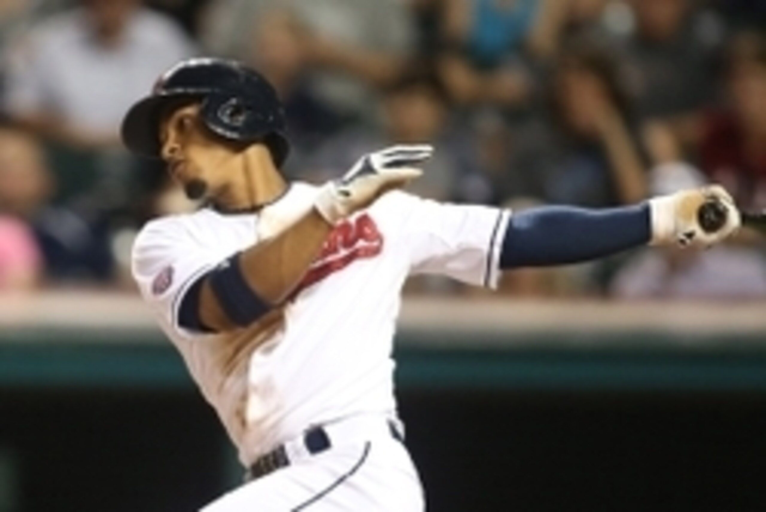Aug 13, 2015; Cleveland, OH, USA; Cleveland Indians shortstop Francisco Lindor (12) singles against the New York Yankees during the seventh inning at Progressive Field. Mandatory Credit: Charles LeClaire-USA TODAY Sports