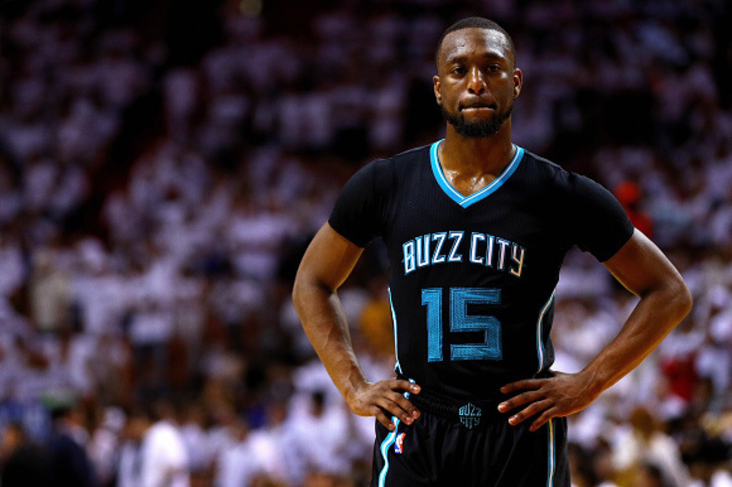 MIAMI, FL - MAY 01:  Kemba Walker #15 of the Charlotte Hornets looks on during Game Seven of the Eastern Conference Quarterfinals of the 2016 NBA Playoffs against the Miami Heat at American Airlines Arena on May 1, 2016 in Miami, Florida. NOTE TO USER: Us