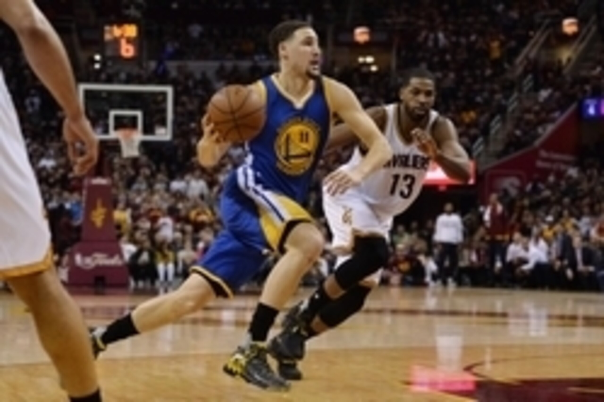 Jun 8, 2016; Cleveland, OH, USA; Golden State Warriors guard Klay Thompson (11) dribbles the ball around Cleveland Cavaliers center Tristan Thompson (13) during the second quarter in game three of the NBA Finals at Quicken Loans Arena. Mandatory Credit: K