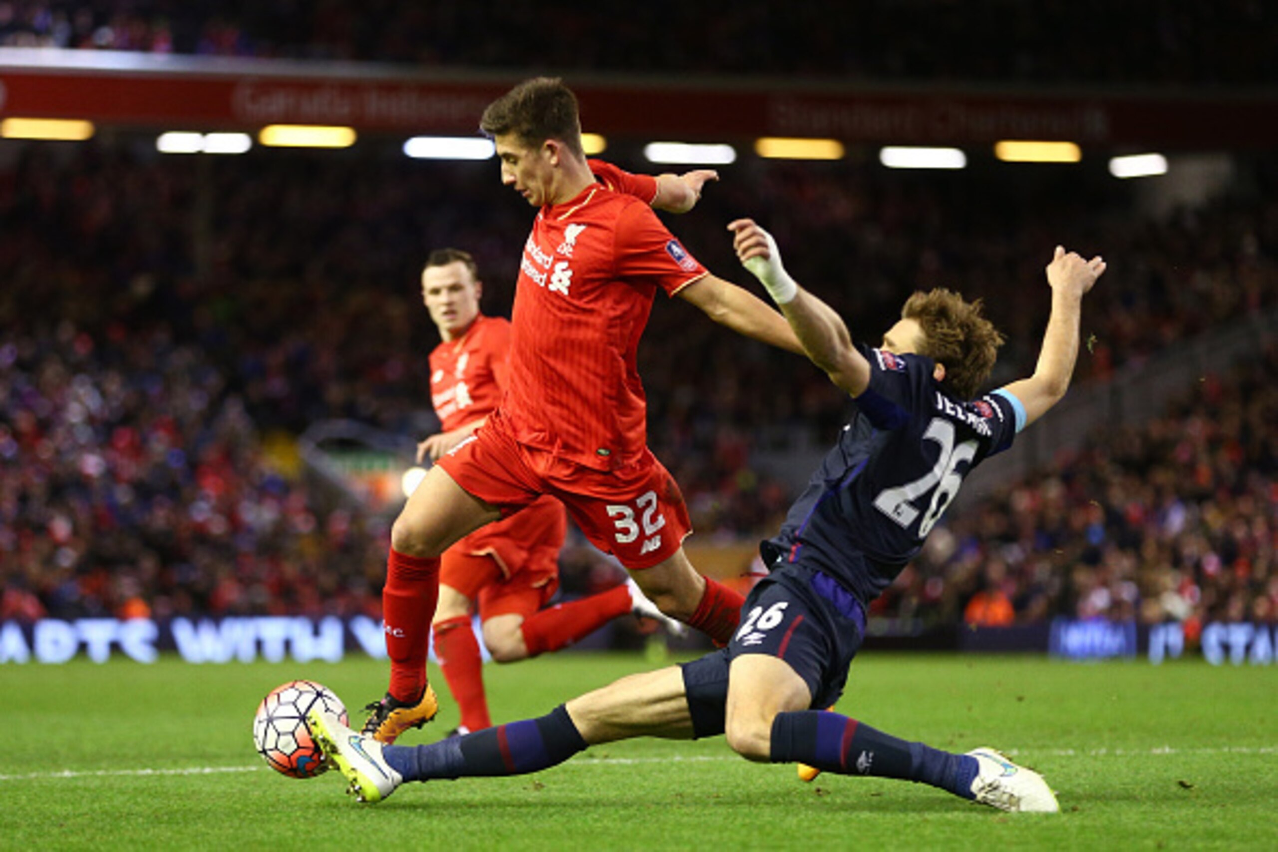 LIVERPOOL, ENGLAND - JANUARY 30:  Cameron Brannagan of Liverpool is tackled by Nikica Jelavic of West Ham United during the Emirates FA Cup Fourth Round match between Liverpool and West Ham United at Anfield on January 30, 2016 in Liverpool, England.  (Ph
