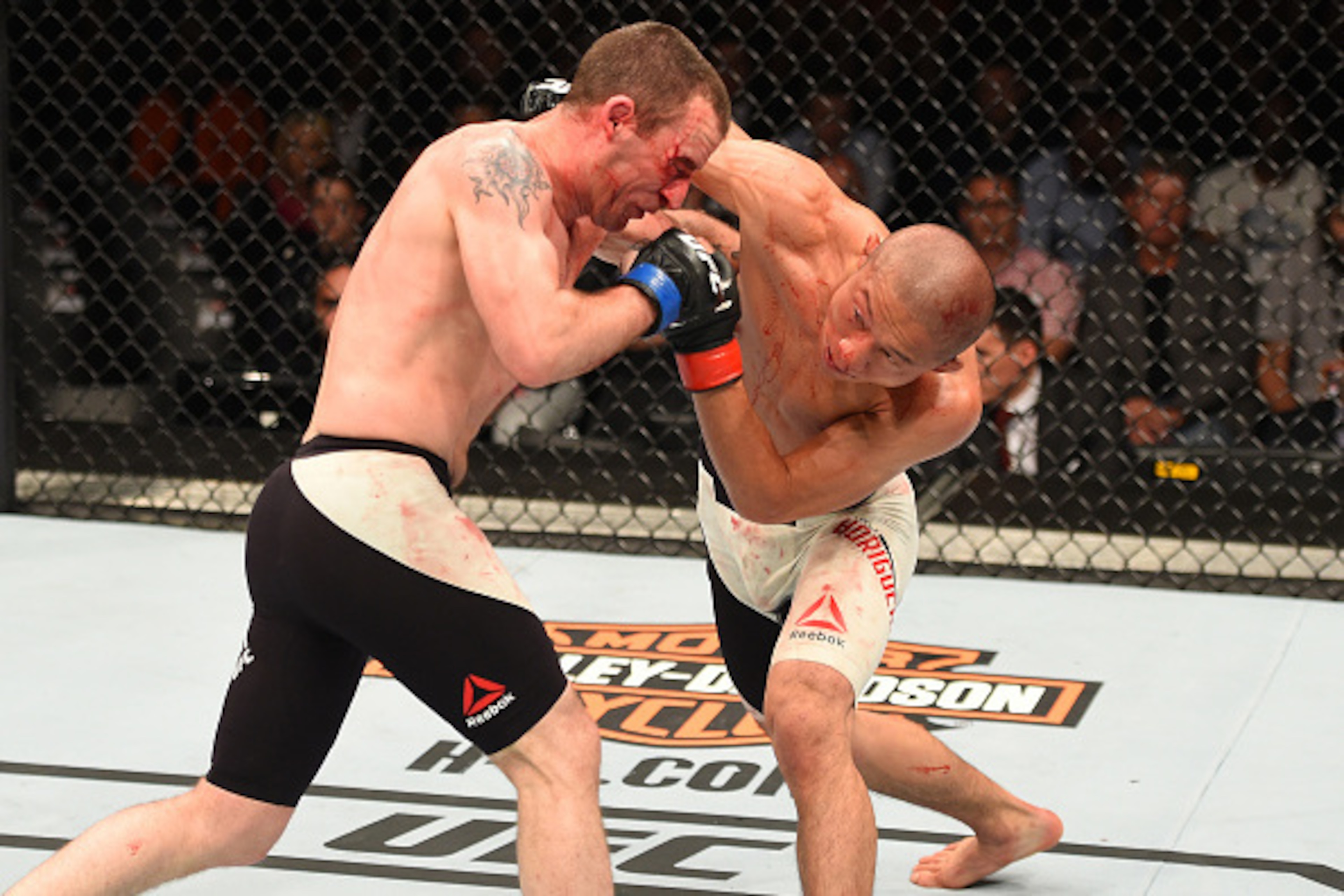 ROTTERDAM, NETHERLANDS - MAY 08:  (R-L) Kyoji Horiguchi punches Neil Seery in their flyweight bout during the UFC Fight Night event at Ahoy Rotterdam on May 8, 2016 in Rotterdam, Netherlands. (Photo by Josh Hedges/Zuffa LLC/Zuffa LLC via Getty Images)