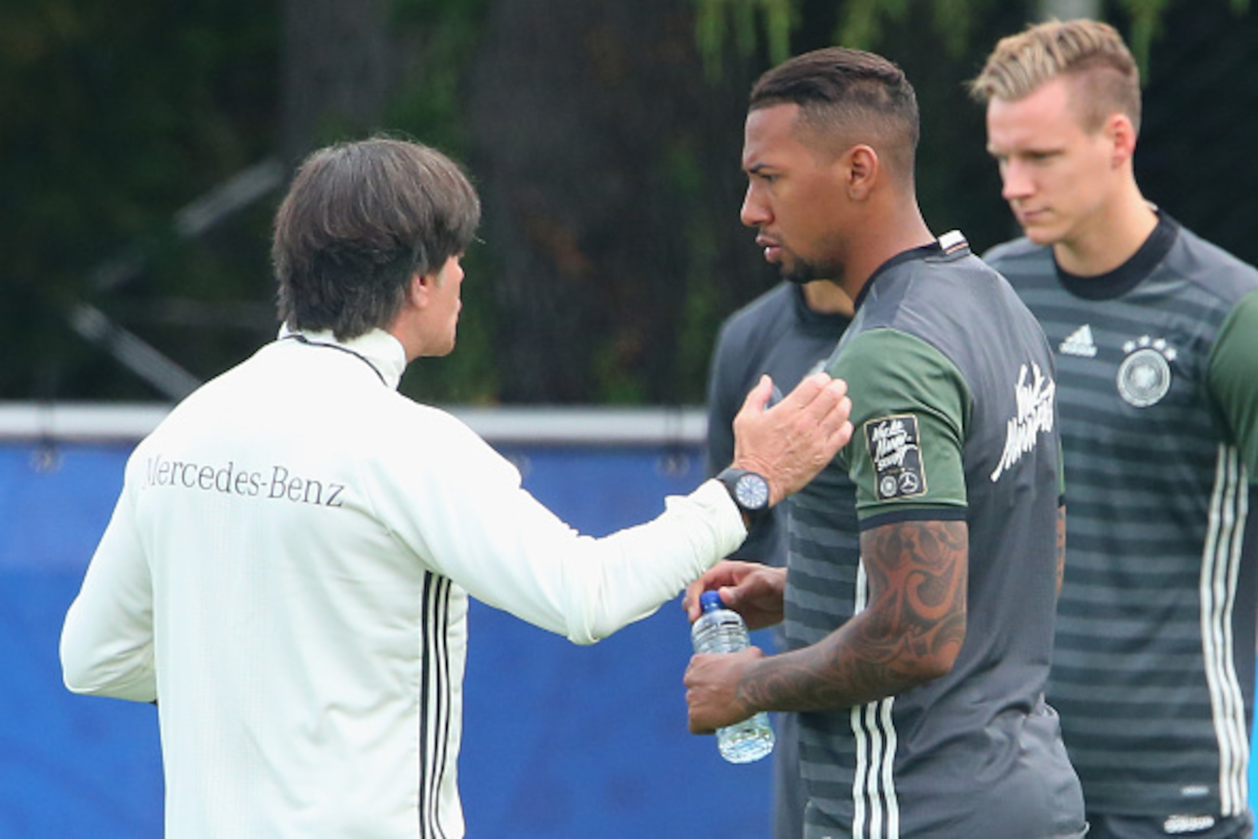 EVIAN-LES-BAINS, FRANCE - JUNE 09:  Joachim Loew, head coach of the German national team talks to his player Jerome Boateng  during a Germany training session ahead of the UEFA EURO 2016 at Ermitage Evian on June 9, 2016 in Evian-les-Bains, France. German