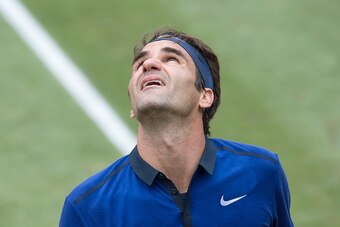Switzerland's Roger Federer looks to the sky during his semifinal match against Austria's Dominic Thiem at the ATP Mercedes Cup tennis tournament in Stuttgart, southwestern Germany, on June 11, 2016.   / AFP / THOMAS KIENZLE        (Photo credit should re