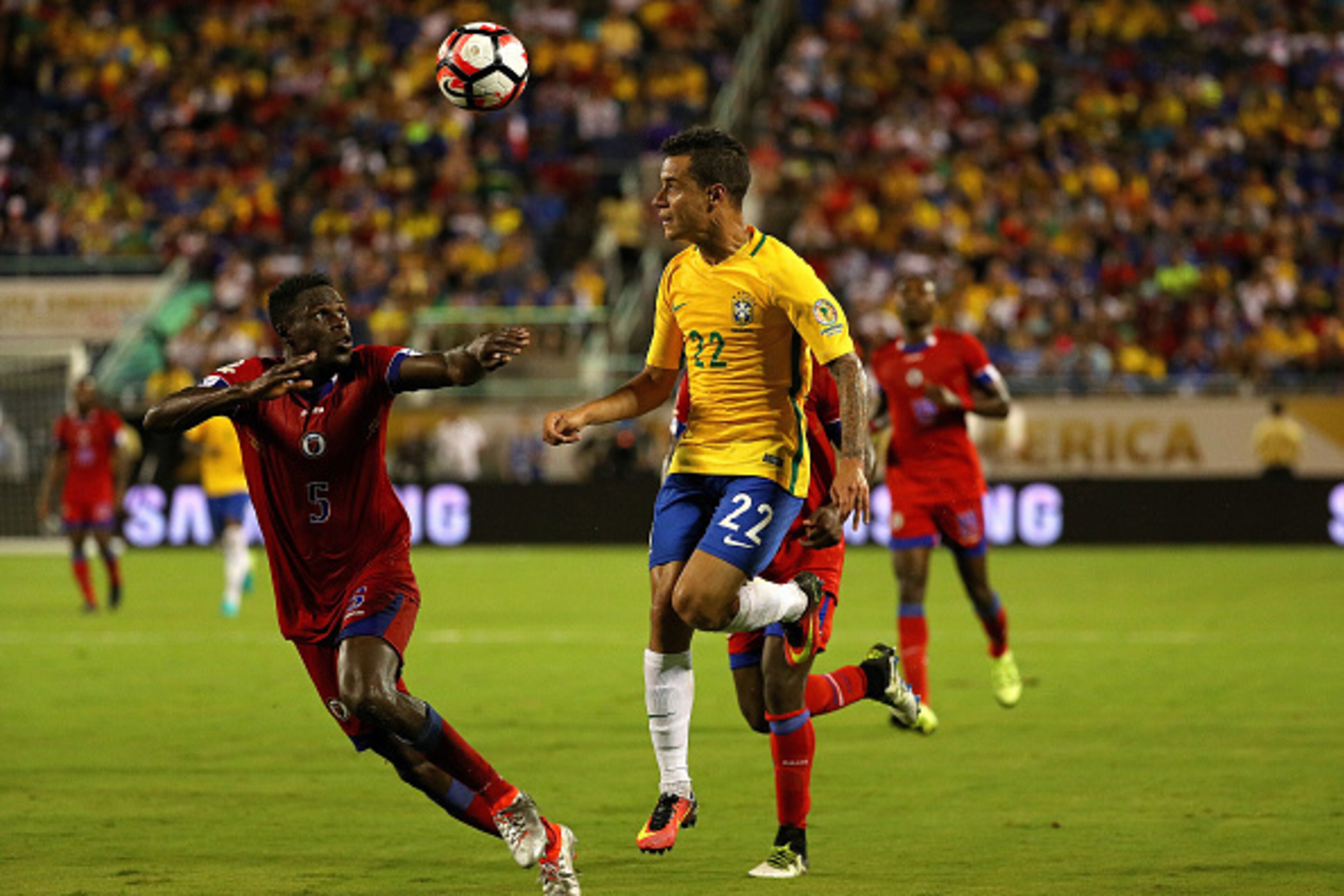ORLANDO, FL - JUNE 08: Philippe Coutinho #22 of Brazil and Romain Genevois #5 of Haiti fight for the ball during a Group B match of the 2016 Copa America Centenario at Camping World Stadium on June 8, 2016 in Orlando, Florida. (Photo by Mike Ehrmann/Gett ORLANDO, FL - JUNE 08: Philippe Coutinho #22 of Brazil and Romain Genevois #5 of Haiti fight for the ball during a Group B match of the 2016 Copa America Centenario at Camping World Stadium on June 8, 2016 in Orlando, Florida. (Photo by Mike Ehrmann/Gett