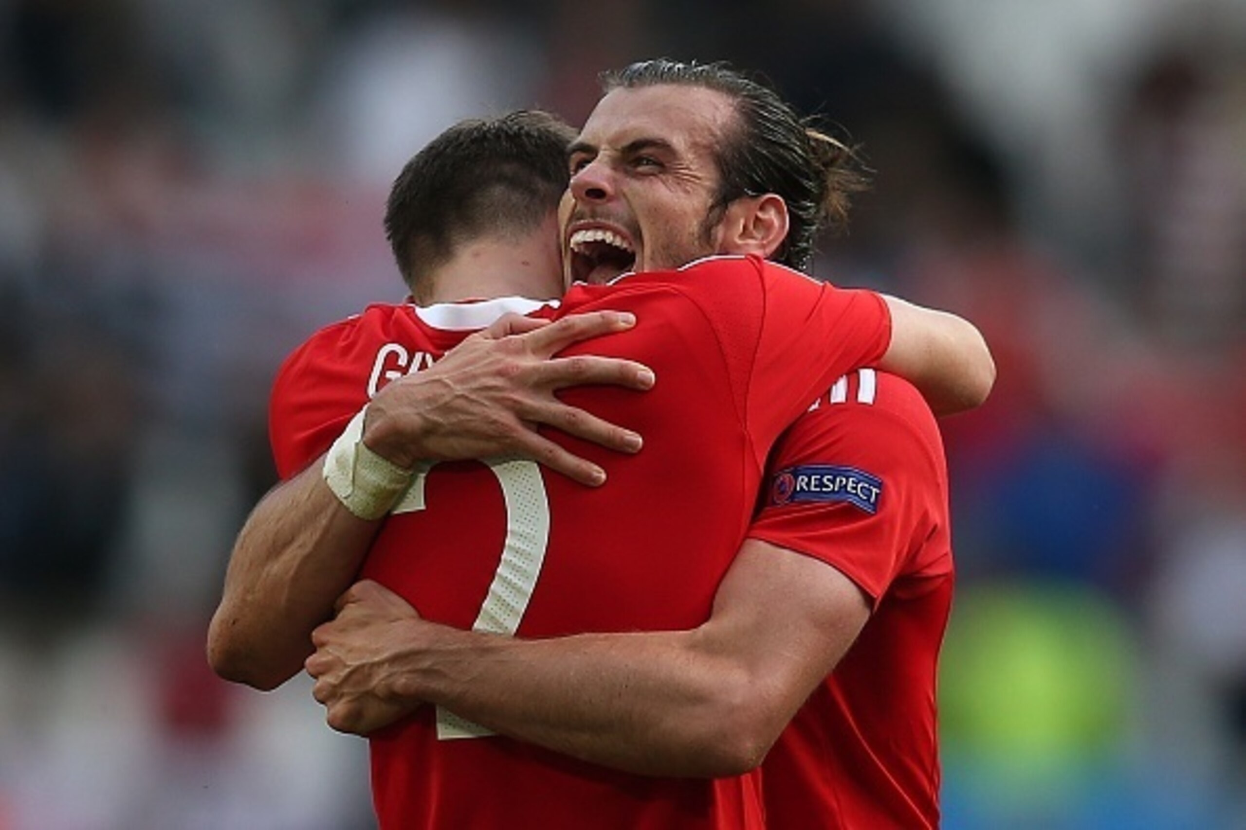 BORDEAUX, FRANCE - JUNE 11: Gareth Bale of Wales celebrates at full-time with team-mate Chris Gunther following the UEFA Euro 2016 Group B match between Wales and Slovakia at Nouveau Stade de Bordeaux on June 11, 2016 in Bordeaux, France. (Photo by Chris BORDEAUX, FRANCE - JUNE 11: Gareth Bale of Wales celebrates at full-time with team-mate Chris Gunther following the UEFA Euro 2016 Group B match between Wales and Slovakia at Nouveau Stade de Bordeaux on June 11, 2016 in Bordeaux, France. (Photo by Chris