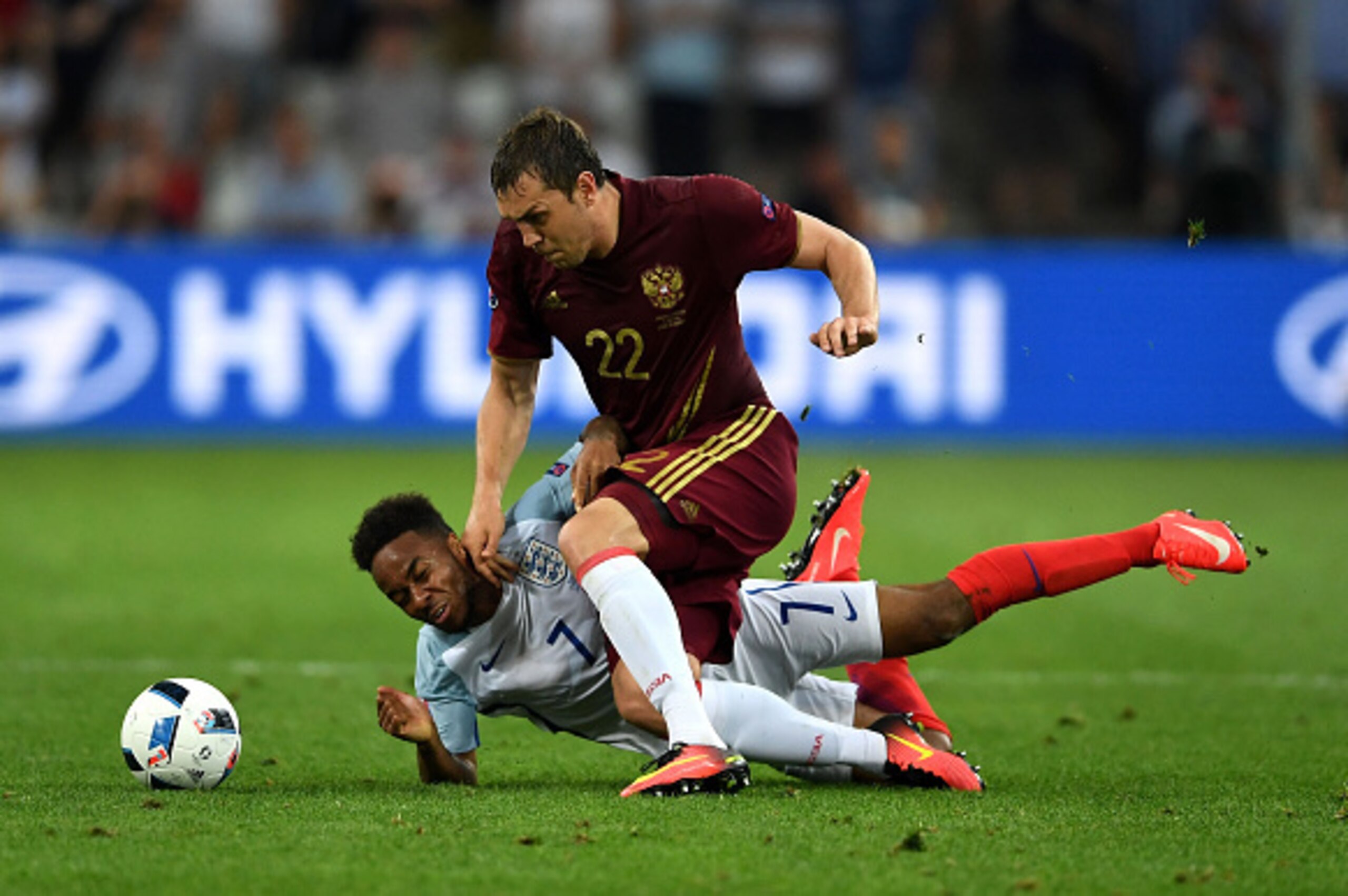 MARSEILLE, FRANCE - JUNE 11:  Raheem Sterling of England and Artem Dzyuba of Russia compete for the ball during the UEFA EURO 2016 Group B match between England and Russia at Stade Velodrome on June 11, 2016 in Marseille, France.  (Photo by Laurence Griff