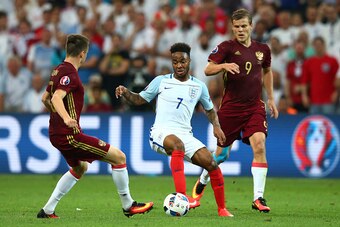 MARSEILLE, FRANCE - JUNE 11:  Raheem Sterling (C) of England competes for the ball against Aleksandr Golovin (L) and Aleksandr Kokorin (R) of Russia during the UEFA EURO 2016 Group B match between England and Russia at Stade Velodrome on June 11, 2016 in 