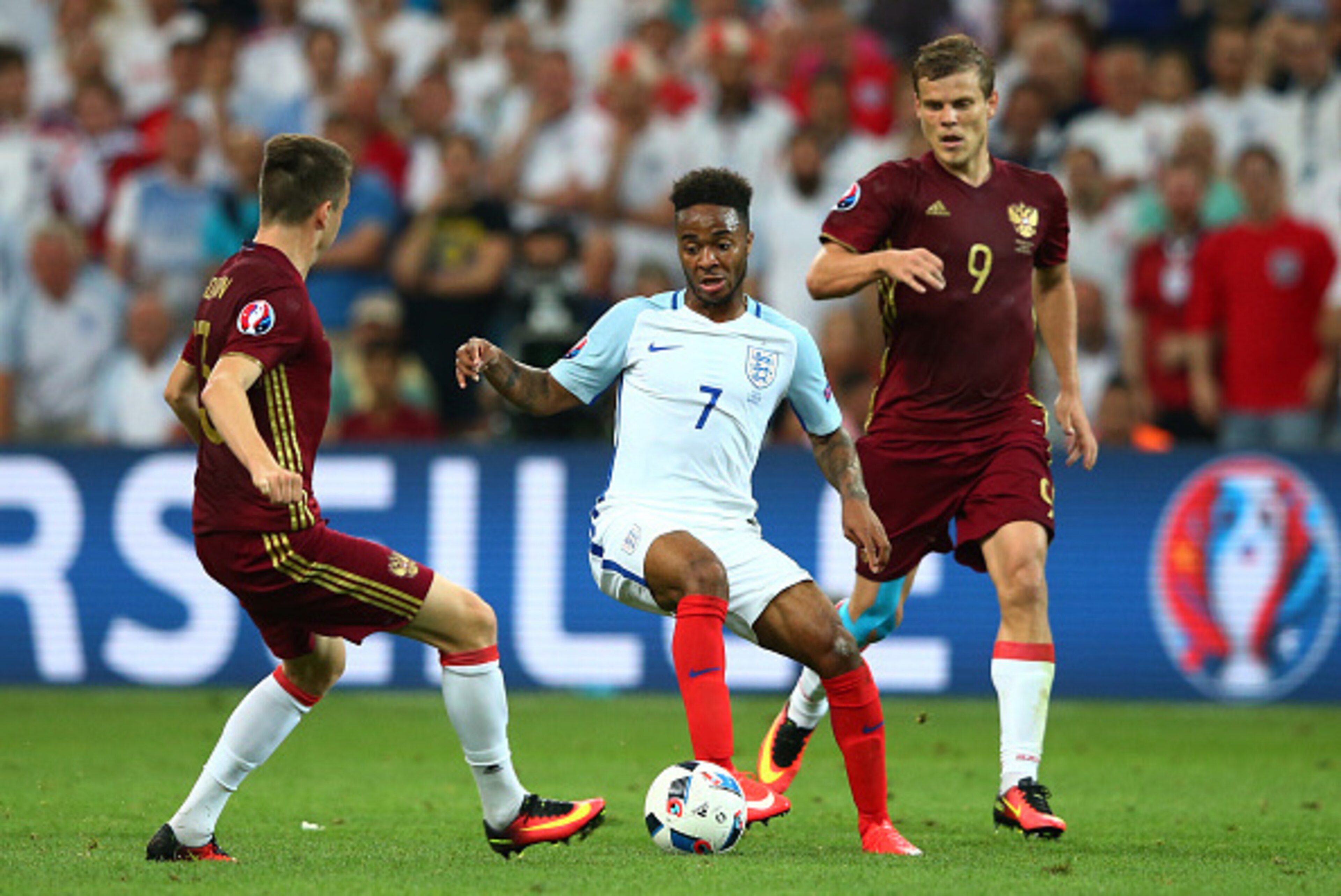 MARSEILLE, FRANCE - JUNE 11:  Raheem Sterling (C) of England competes for the ball against Aleksandr Golovin (L) and Aleksandr Kokorin (R) of Russia during the UEFA EURO 2016 Group B match between England and Russia at Stade Velodrome on June 11, 2016 in 