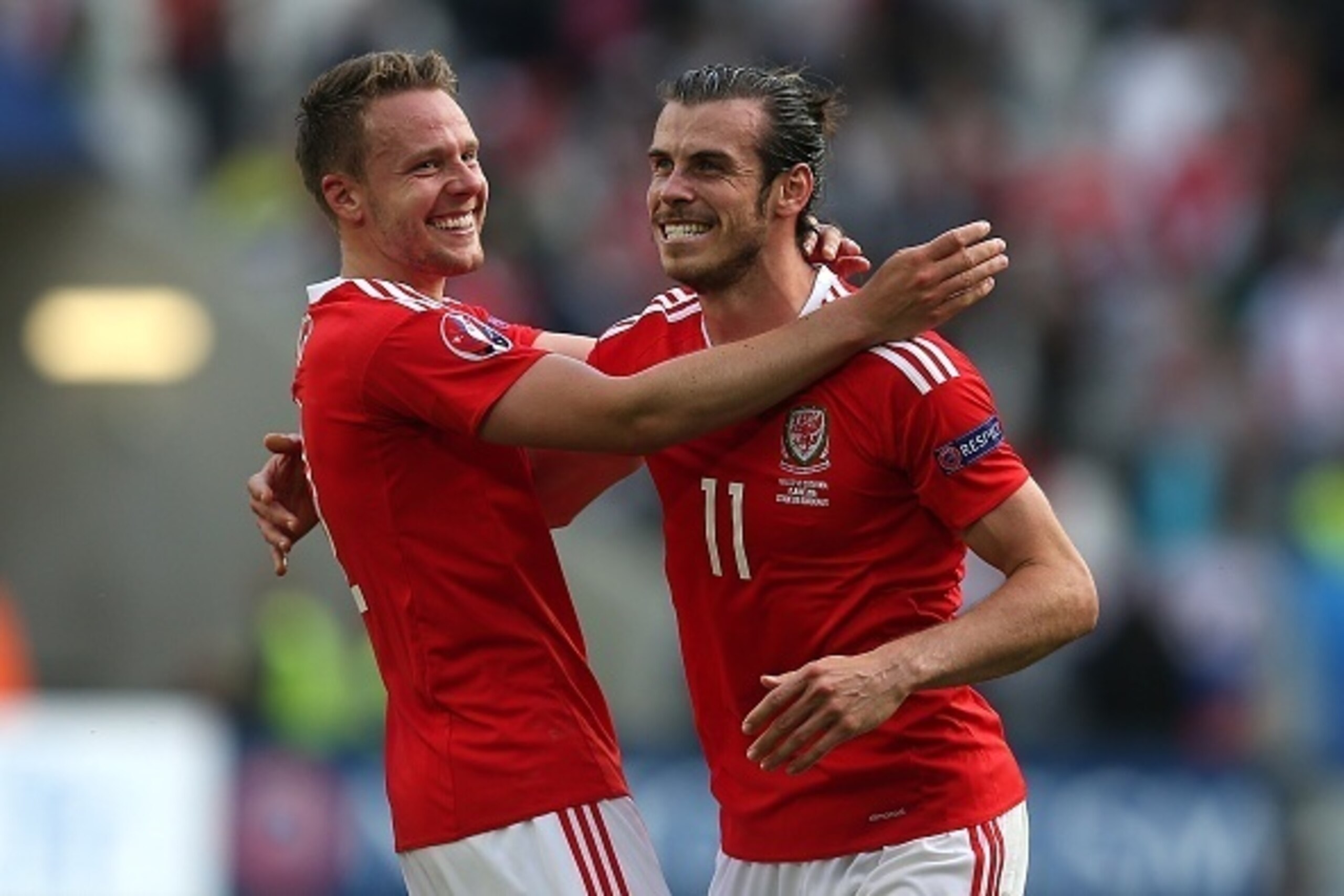 BORDEAUX, FRANCE - JUNE 11: Gareth Bale of Wales celebrates at full-time with team-mate Chris Gunther following the UEFA Euro 2016 Group B match between Wales and Slovakia at Nouveau Stade de Bordeaux on June 11, 2016 in Bordeaux, France. (Photo by Chris 