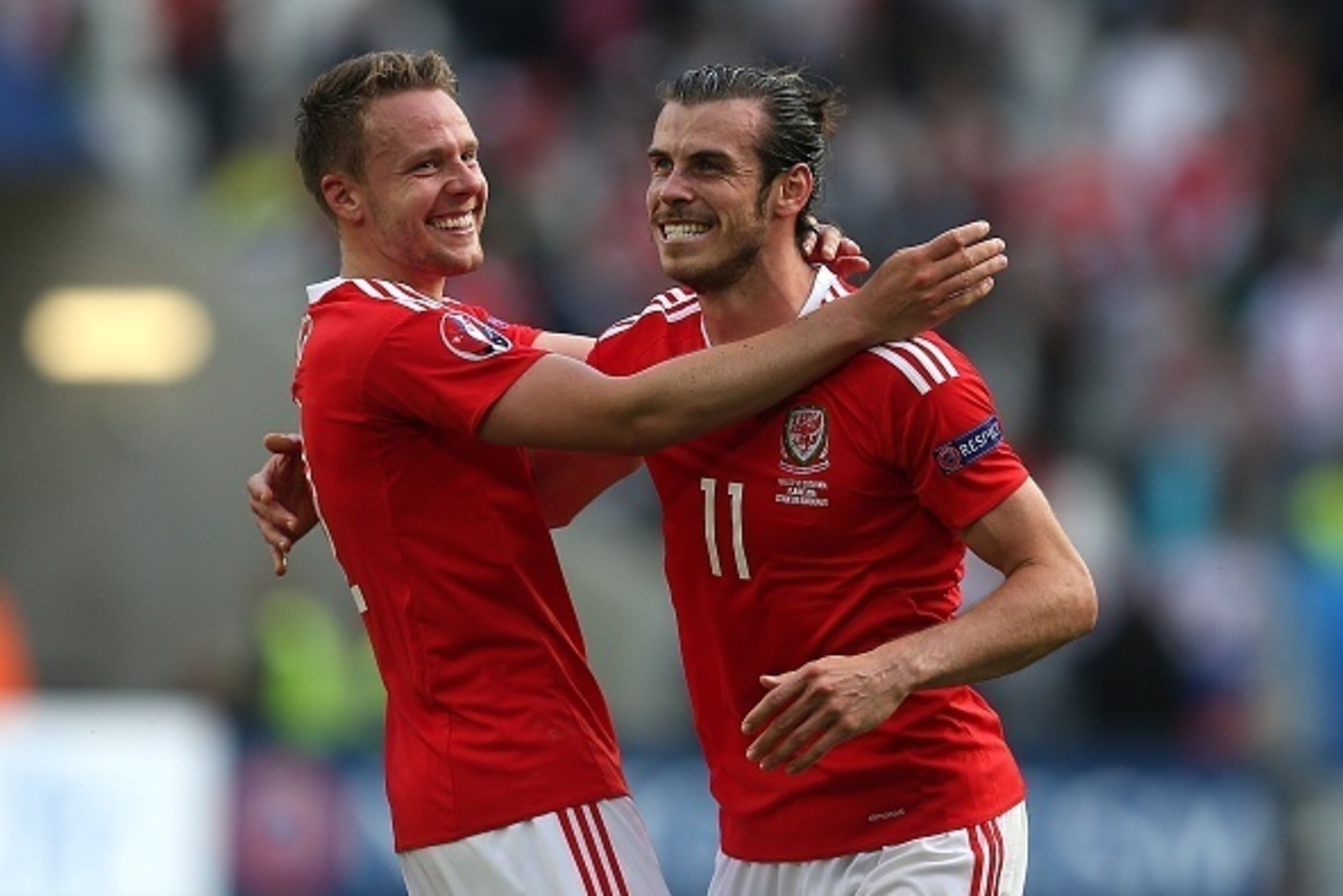 BORDEAUX, FRANCE - JUNE 11: Gareth Bale of Wales celebrates at full-time with team-mate Chris Gunther following the UEFA Euro 2016 Group B match between Wales and Slovakia at Nouveau Stade de Bordeaux on June 11, 2016 in Bordeaux, France. (Photo by Chris 
