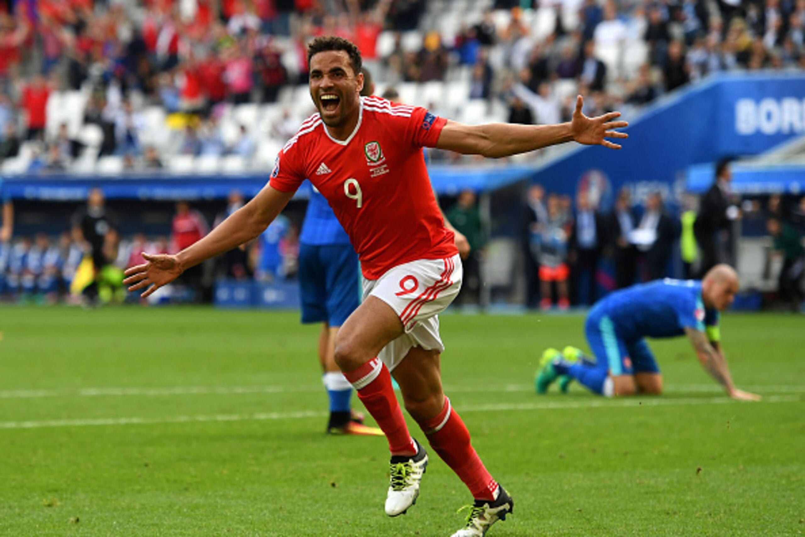 BORDEAUX, FRANCE - JUNE 11: Hal Robson-Kanu of Wales celebrates scoring his team's second goal during the UEFA EURO 2016 Group B match between Wales and Slovakia at Stade Matmut Atlantique on June 11, 2016 in Bordeaux, France.  (Photo by Stu Forster/Getty