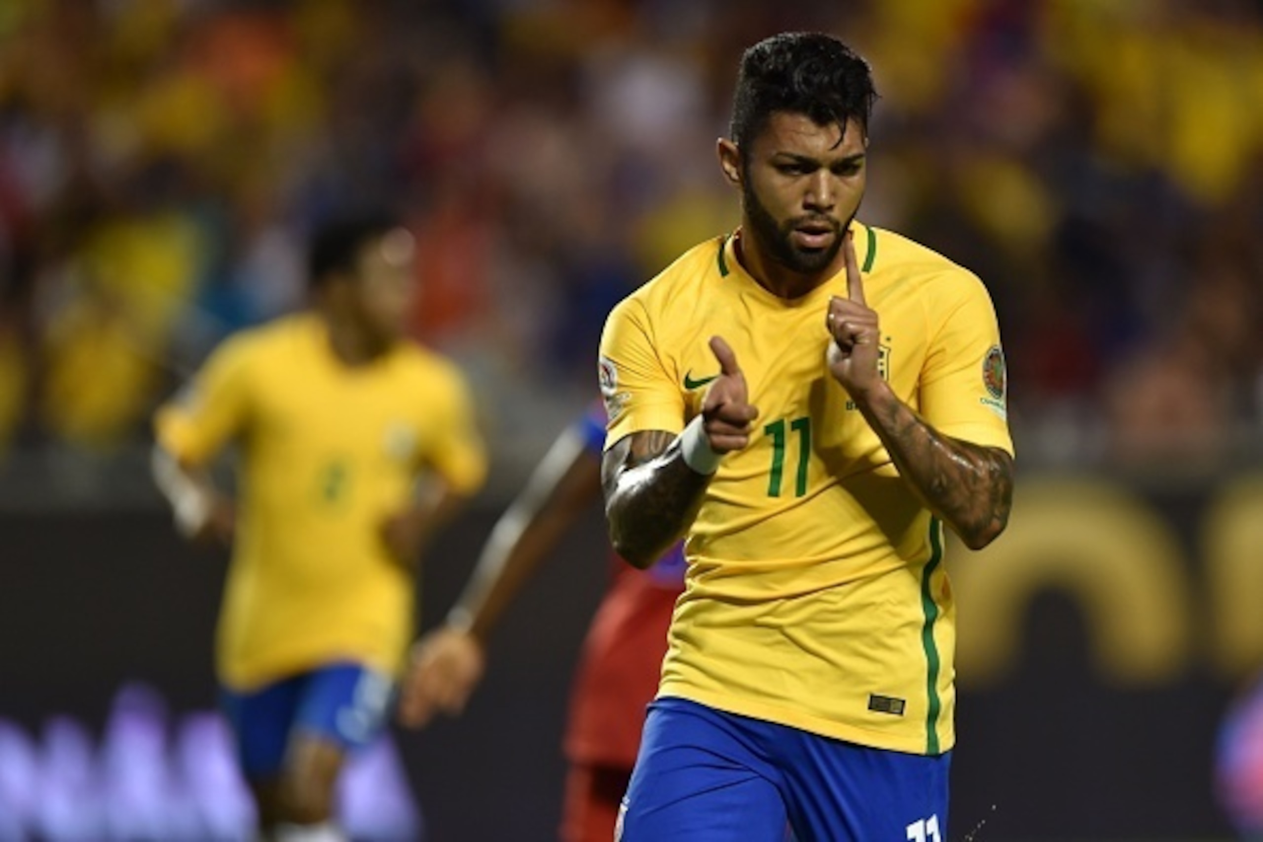 Brazil's Gabriel celebrates after scoring against Haiti during a Copa America Centenario football match in Orlando, Florida, United States, on June 8, 2016.  / AFP / Hector RETAMAL        (Photo credit should read HECTOR RETAMAL/AFP/Getty Images)