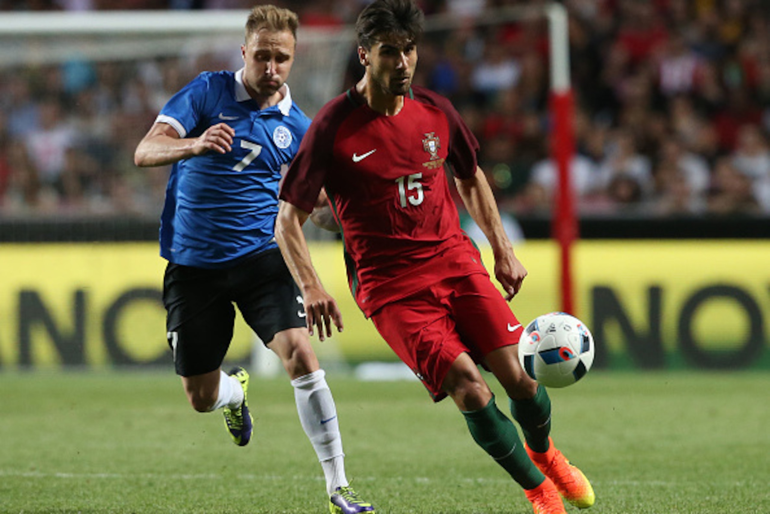 LISBON, PORTUGAL - JUNE 8: Portugal midfielder Andre Gomes with Estonia's midfielder Sander Puri in action during the International Friendly match between Portugal and Estonia at Estadio da Luz on June 8, 2016 in Lisbon, Portugal.  (Photo by Gualter Fatia