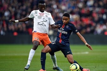 Paris Saint-Germain's French forward Christopher Alan Nkunku (R) vies for the ball with Montpellier's Chadian forward Casimir Ninga  during the French L1 football match between Paris Saint-Germain (PSG) and Montpellier (MHSC) on March 5, 2016, at the Parc