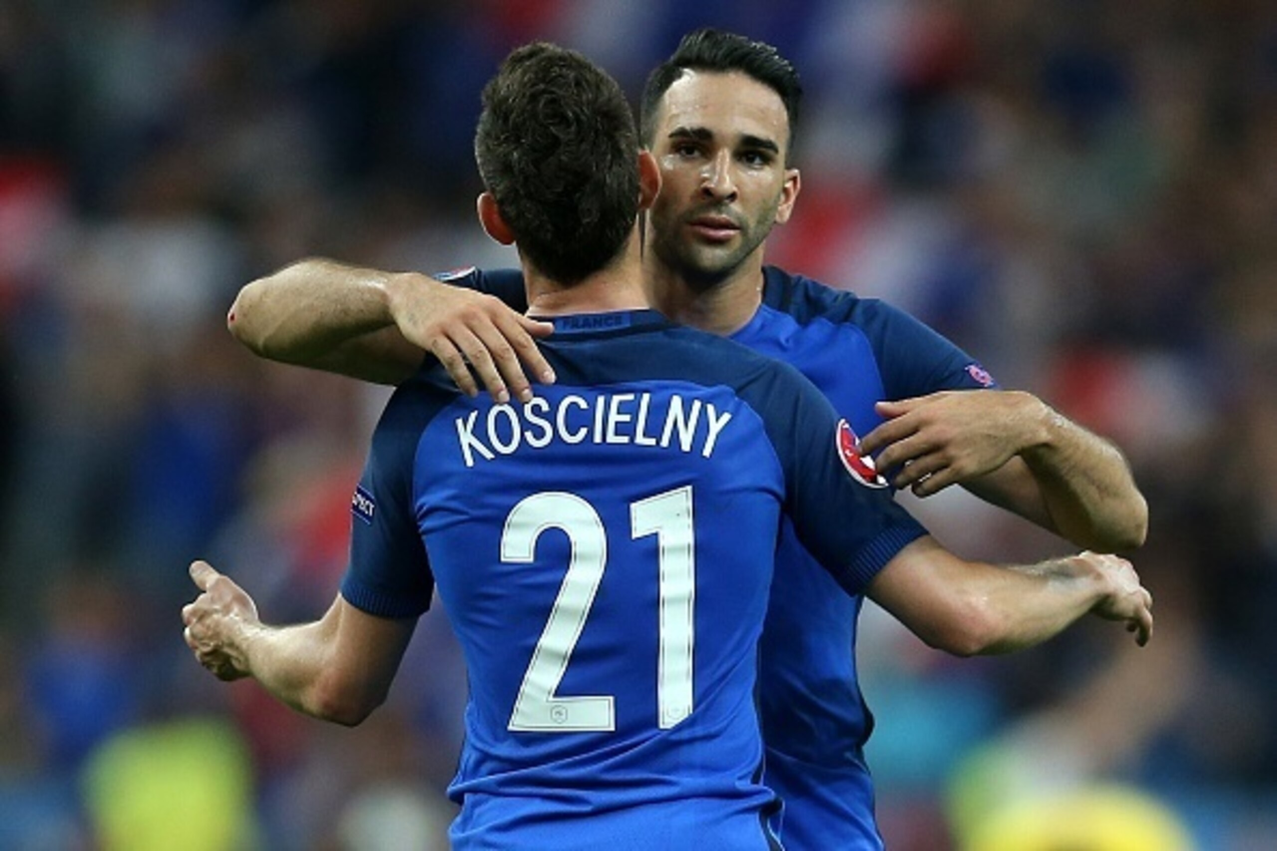 PARIS, FRANCE - JUNE 10: Laurent Koscielny of France embraces team-mate Adil Rami at full-time following the UEFA Euro 2016 Group A match between France and Romania at Stade de France on June 10, 2016 in Paris, France. (Photo by Chris Brunskill Ltd/Getty
