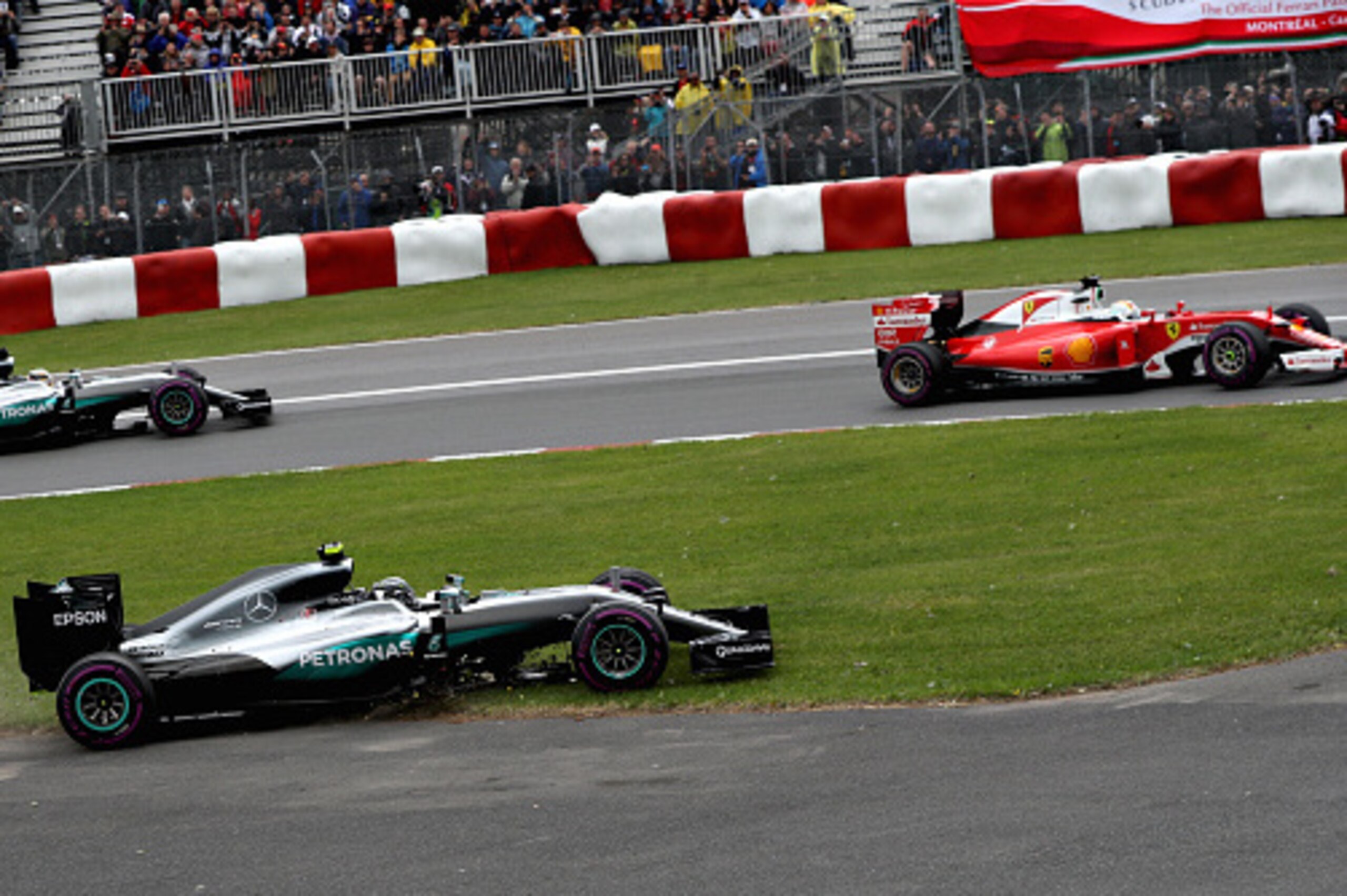 MONTREAL, QC - JUNE 12: Nico Rosberg of Germany driving the (6) Mercedes AMG Petronas F1 Team Mercedes tF1 WO7 Mercedes PU106C Hybrid turbo akes the escape road as Sebastian Vettel of Germany driving the (5) Scuderia Ferrari SF16-H Ferrari 059/5 turbo (Sh