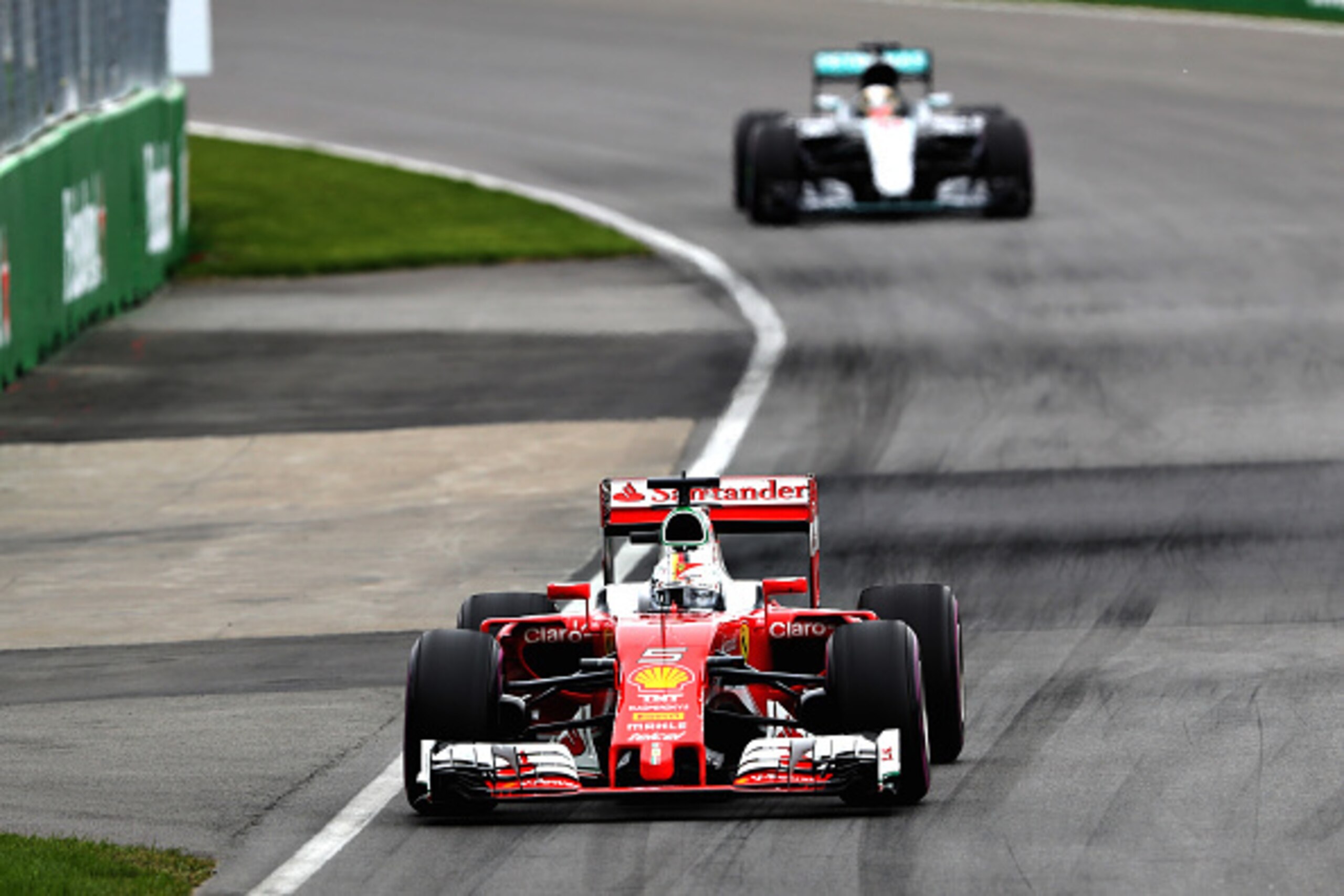 MONTREAL, QC - JUNE 12: Sebastian Vettel of Germany driving the (5) Scuderia Ferrari SF16-H Ferrari 059/5 turbo (Shell GP) leads Lewis Hamilton of Great Britain driving the (44) Mercedes AMG Petronas F1 Team Mercedes F1 WO7 Mercedes PU106C Hybrid turbo on