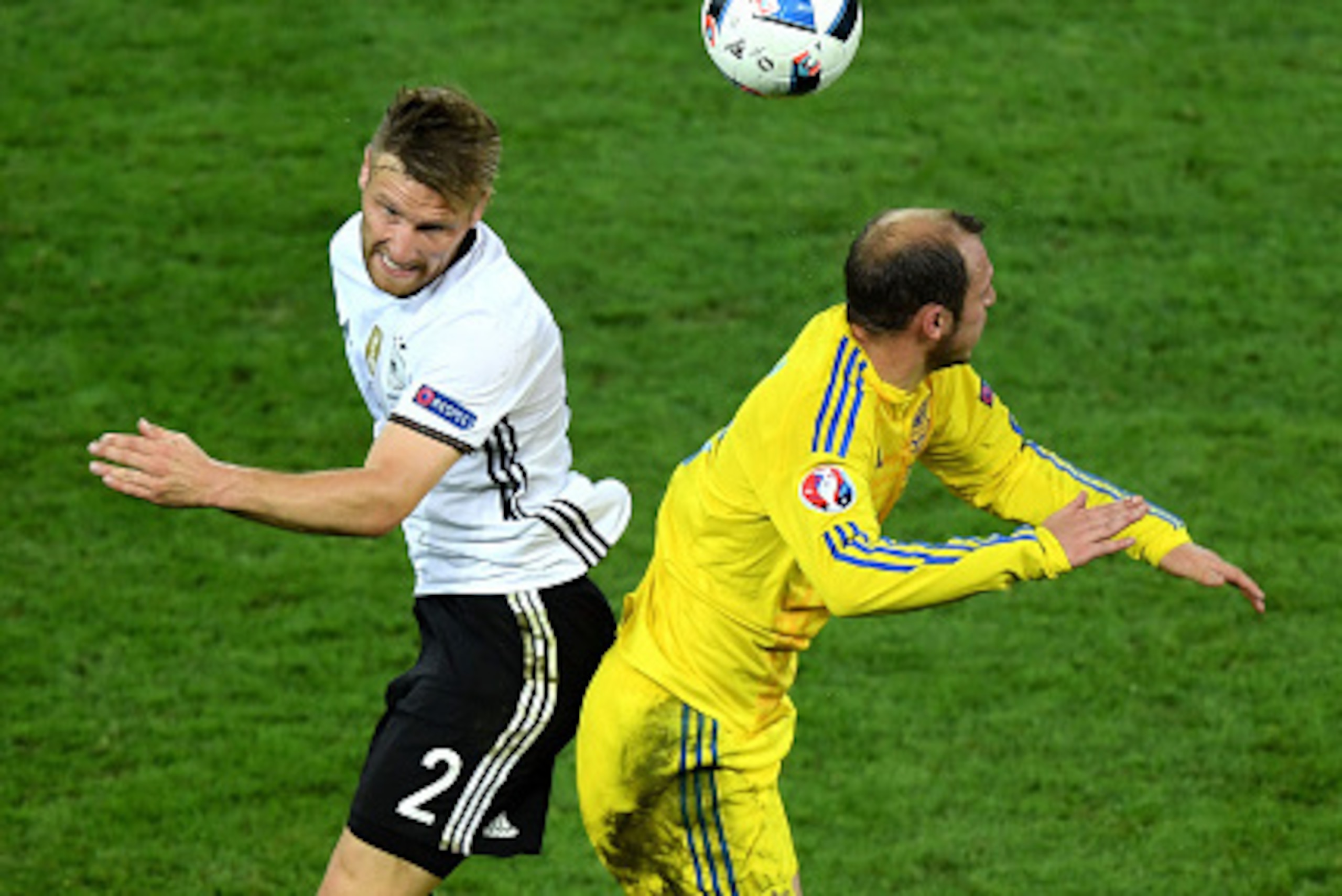 LILLE, FRANCE - JUNE 12:  Shkodran Mustafi of Germany and Roman Zozulya of Ukraine compete for the ball during the UEFA EURO 2016 Group C match between Germany and Ukraine at Stade Pierre-Mauroy on June 12, 2016 in Lille, France.  (Photo by Shaun Botteril
