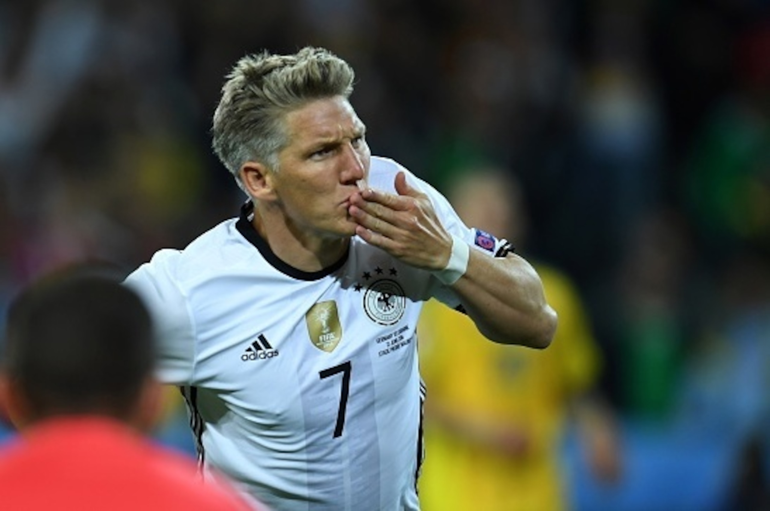 Germany's midfielder Bastian Schweinsteiger celebrates after scoring a goal during the Euro 2016 group C football match between Germany and Ukraine at the Stade Pierre Mauroy in Villeneuve-d'Ascq near Lille on June 12, 2016. / AFP / PATRIK STOLLARZ       