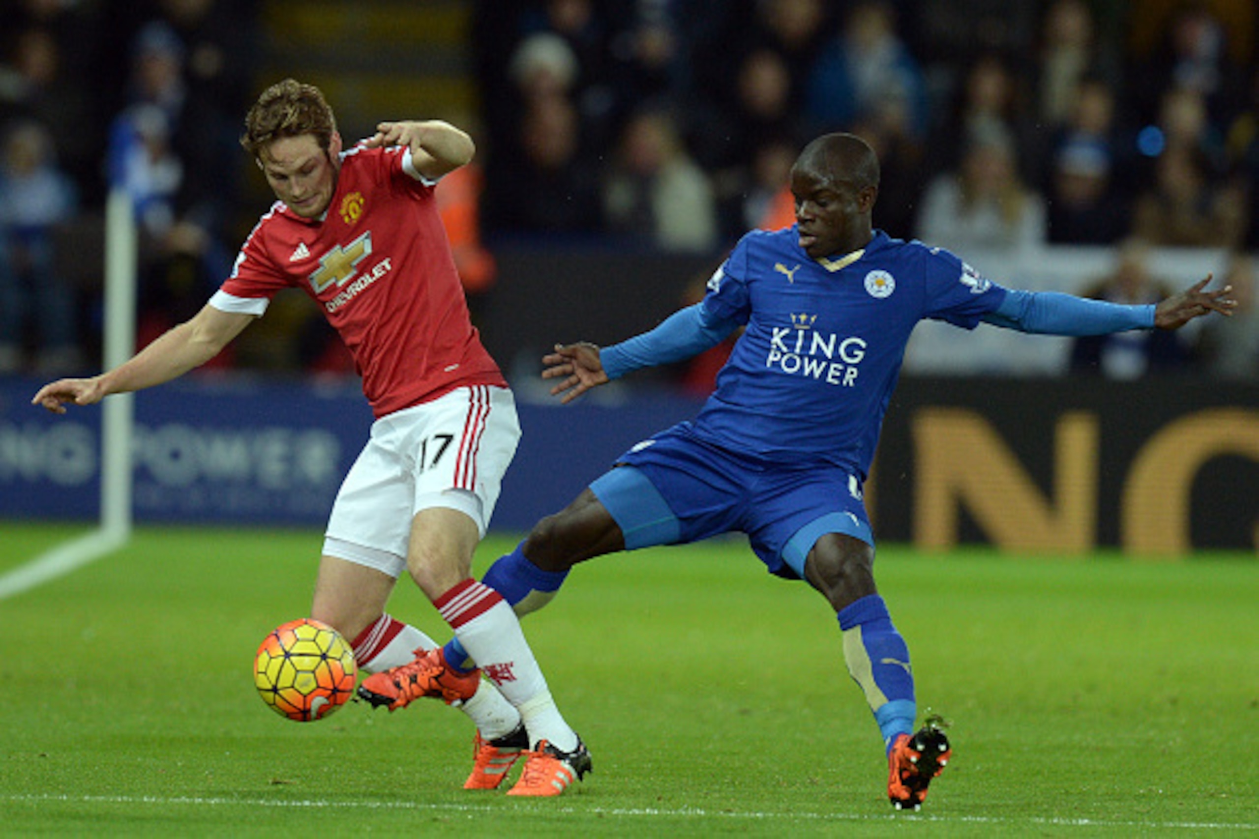 Manchester United's Dutch midfielder Daley Blind (L) vies with Leicester City's French midfielder N'Golo Kante during the English Premier League football match between Leicester City and Manchester United at the King Power Stadium in Leicester, central En