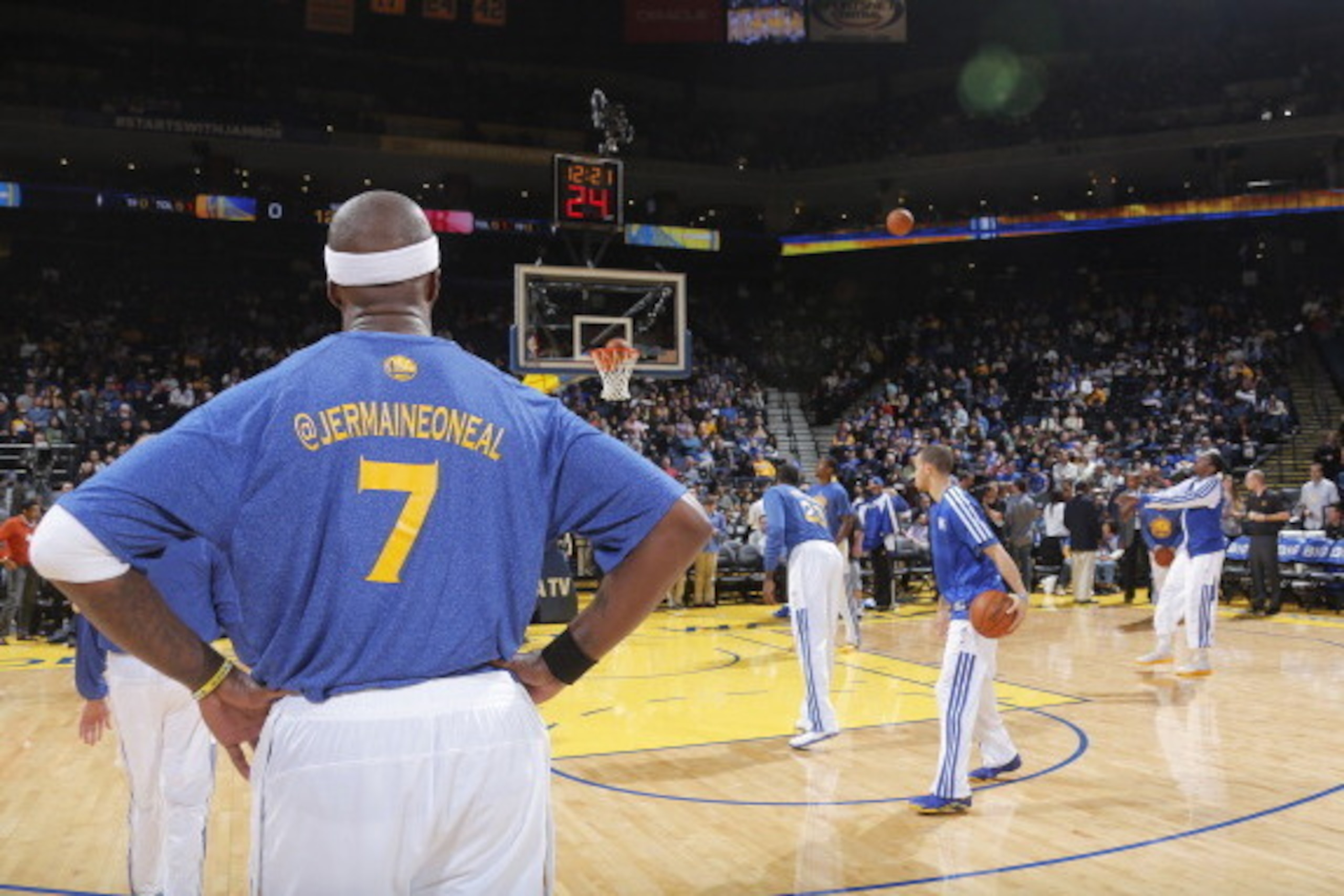 OAKLAND, CA - FEBRUARY 20: Jermaine O'Neal #7 of the Golden State Warriors on social media night, showing his Twitter name on the back of his warm ups on February 20, 2014 at Oracle Arena in Oakland, California. NOTE TO USER: User expressly acknowledges a