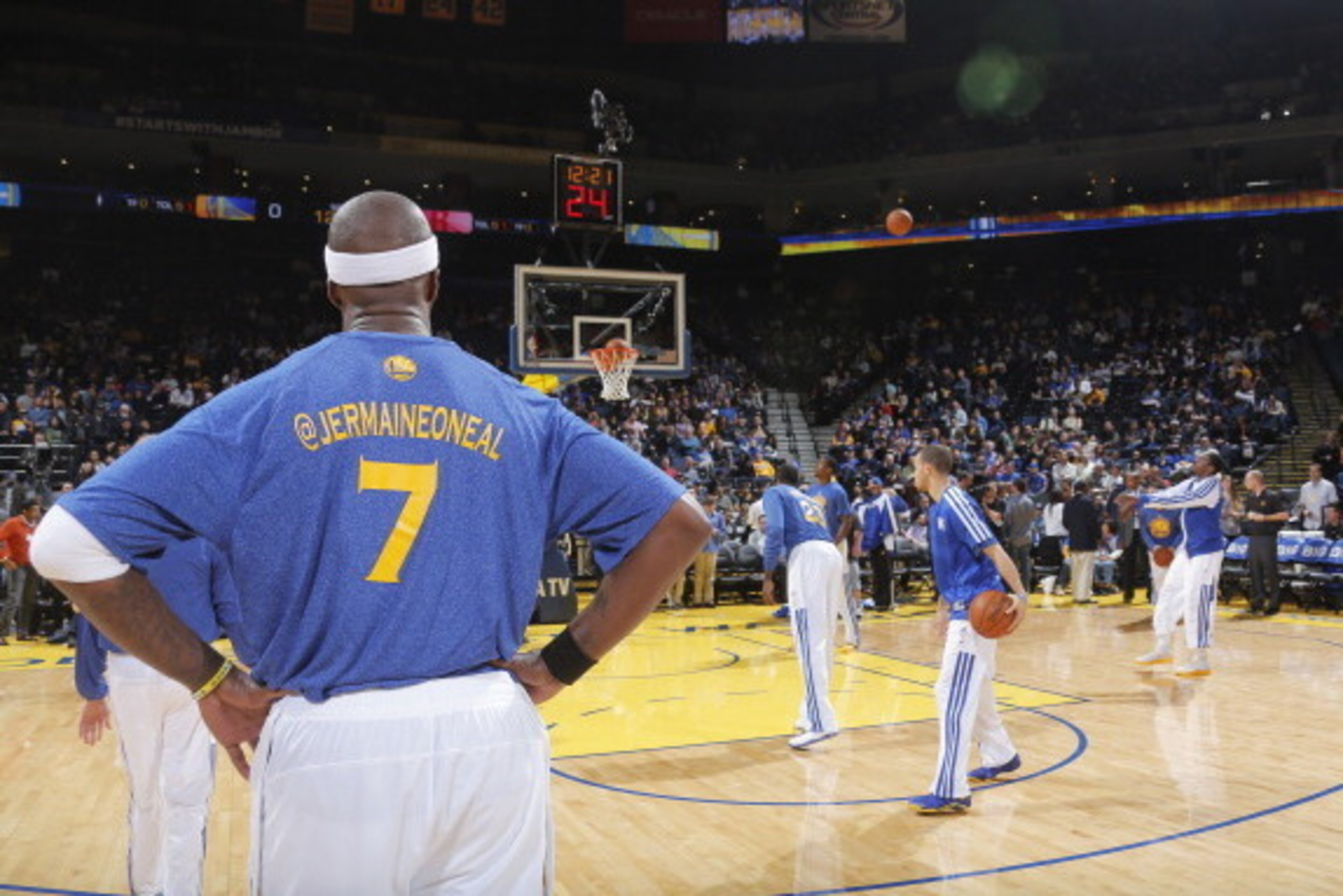 OAKLAND, CA - FEBRUARY 20: Jermaine O'Neal #7 of the Golden State Warriors on social media night, showing his Twitter name on the back of his warm ups on February 20, 2014 at Oracle Arena in Oakland, California. NOTE TO USER: User expressly acknowledges a OAKLAND, CA - FEBRUARY 20: Jermaine O'Neal #7 of the Golden State Warriors on social media night, showing his Twitter name on the back of his warm ups on February 20, 2014 at Oracle Arena in Oakland, California. NOTE TO USER: User expressly acknowledges a