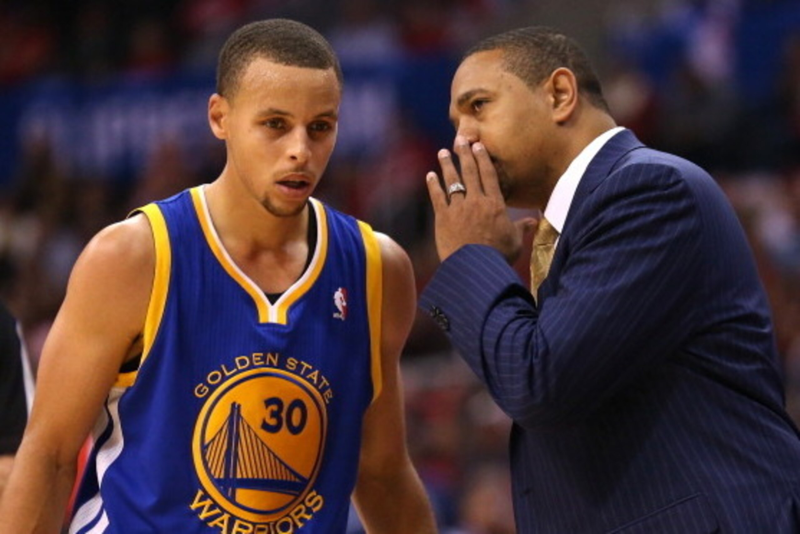 LOS ANGELES, CA - OCTOBER 31:  Head coach Mark Jackson and Stephen Curry #30 of the Golden State Warriors confer in the game with the Los Angeles Clippers at Staples Center on October 31, 2013 in Los Angeles, California. The Clippers won 126-115.  NOTE TO