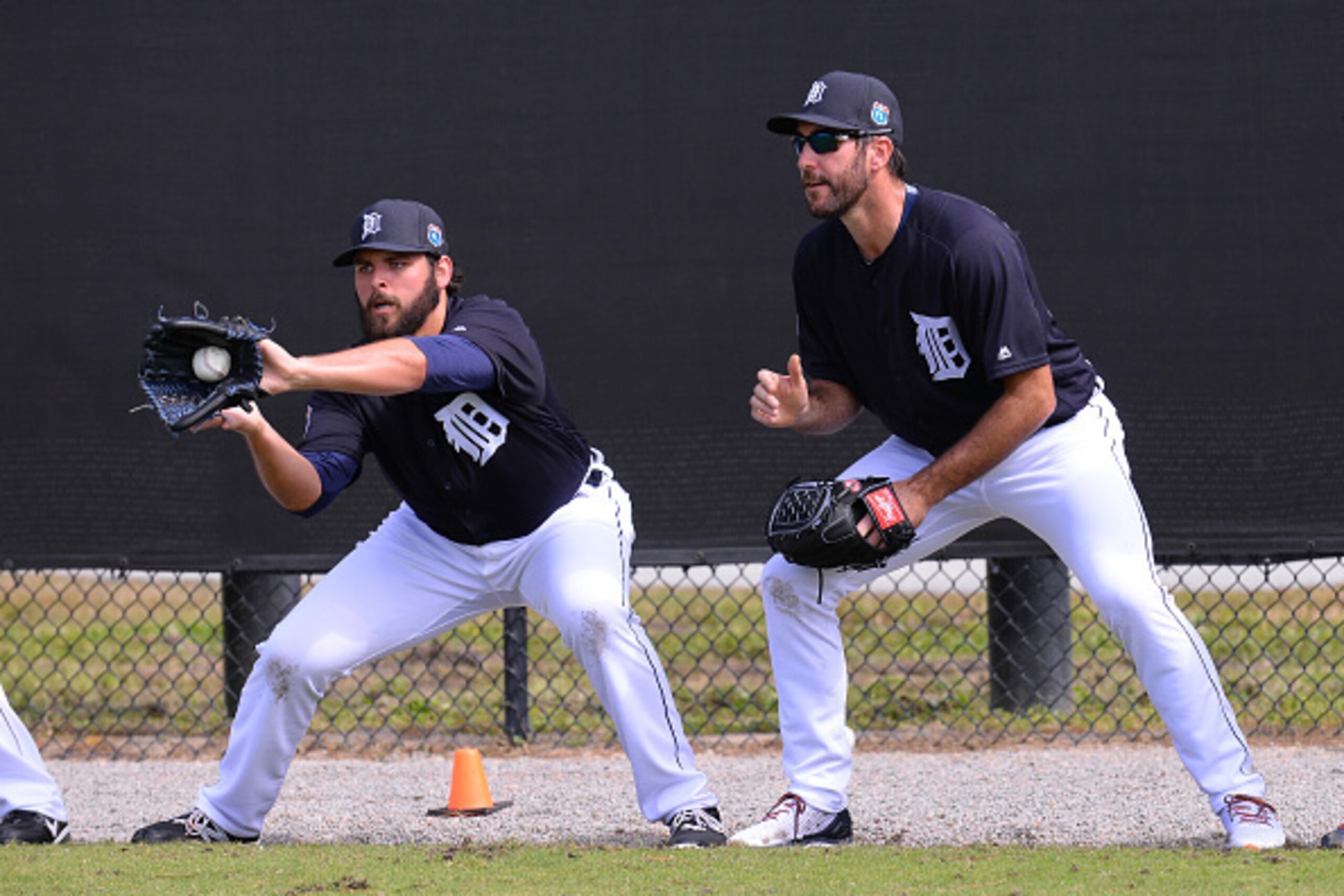 LAKELAND, FL - FEBRUARY 20:  Michael Fulmer #32 (L) and Justin Verlander #35 of the Detroit Tigers field during the rag ball drill during the Spring Training workout day at the TigerTown Facility on February 20, 2016 in Lakeland, Florida.  (Photo by Mark 